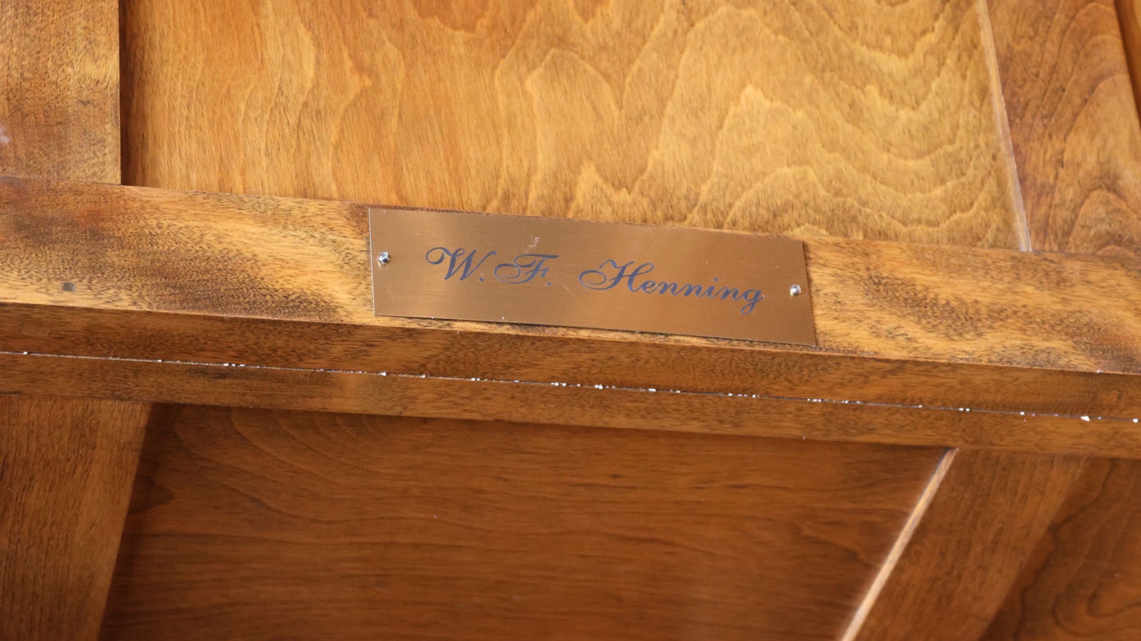 A nameplate above the door in the office of the home still reflects the original owner.