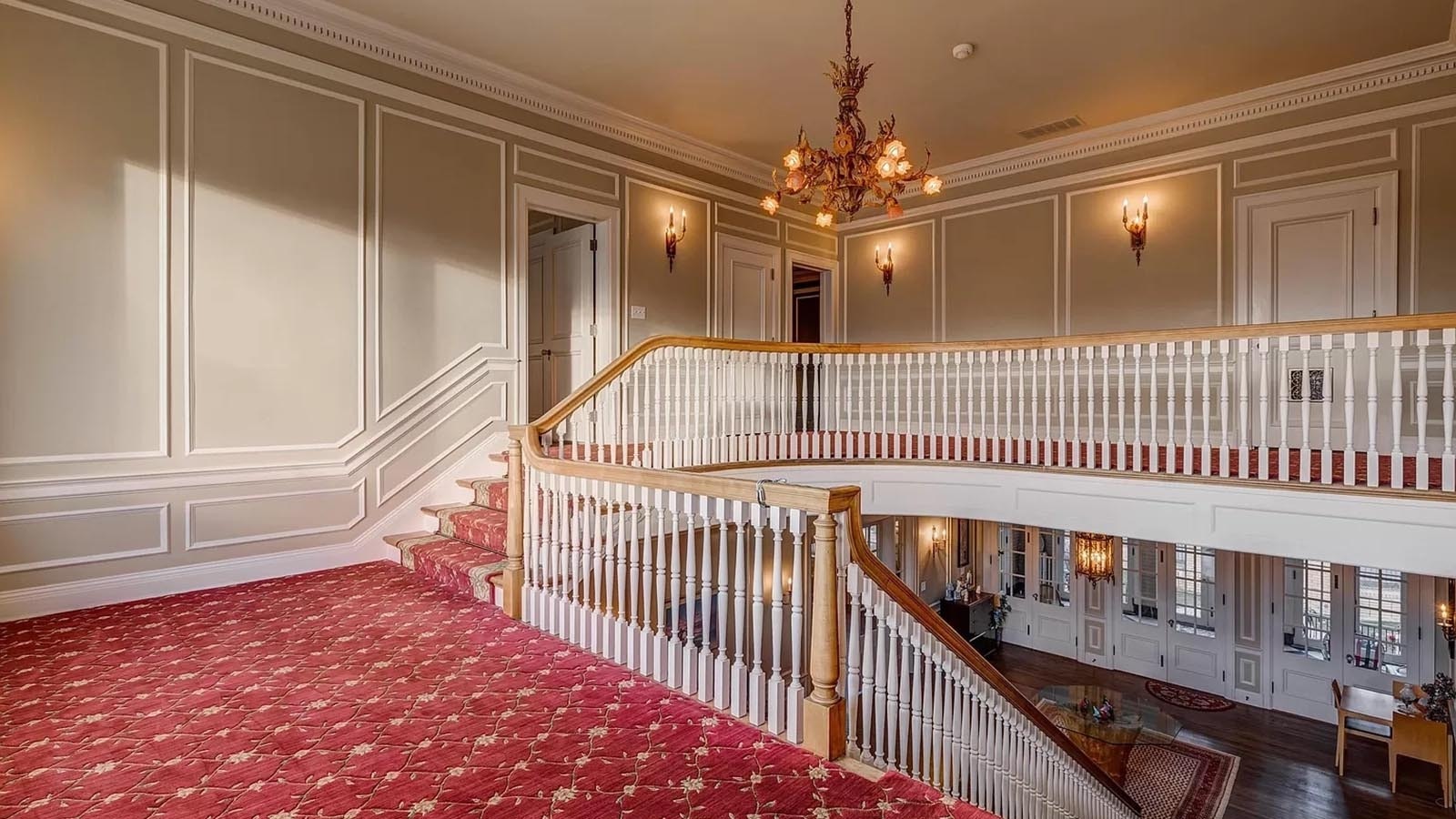 Stairs led from the entry hall to the second-floor area with a landing in-between.