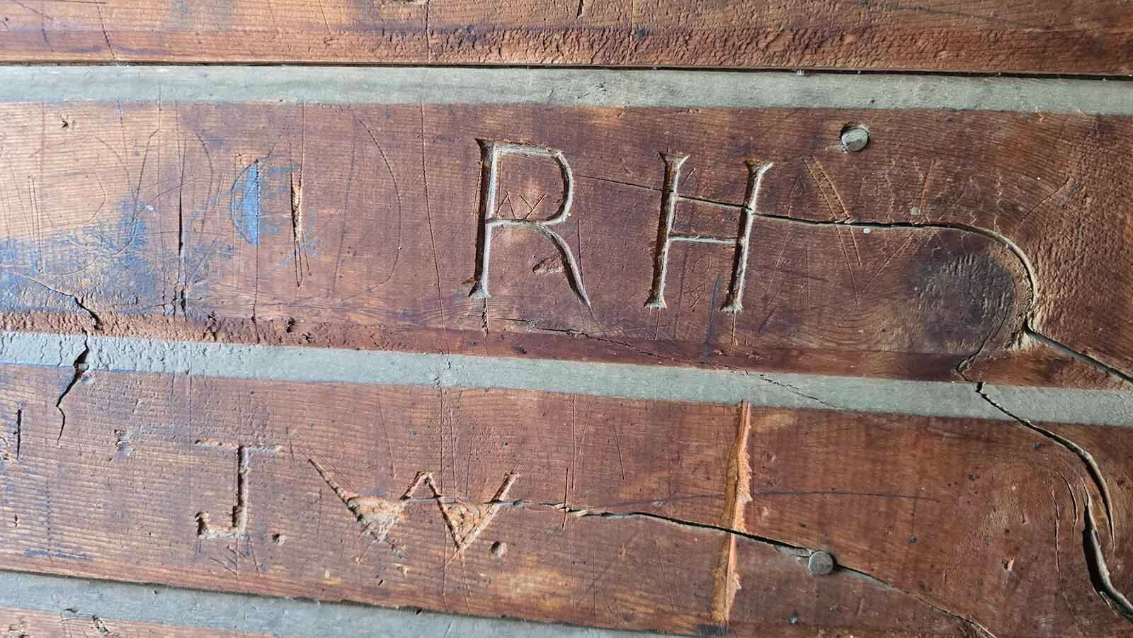 Initials carved into the walls at Wyoming Hereford Ranch.