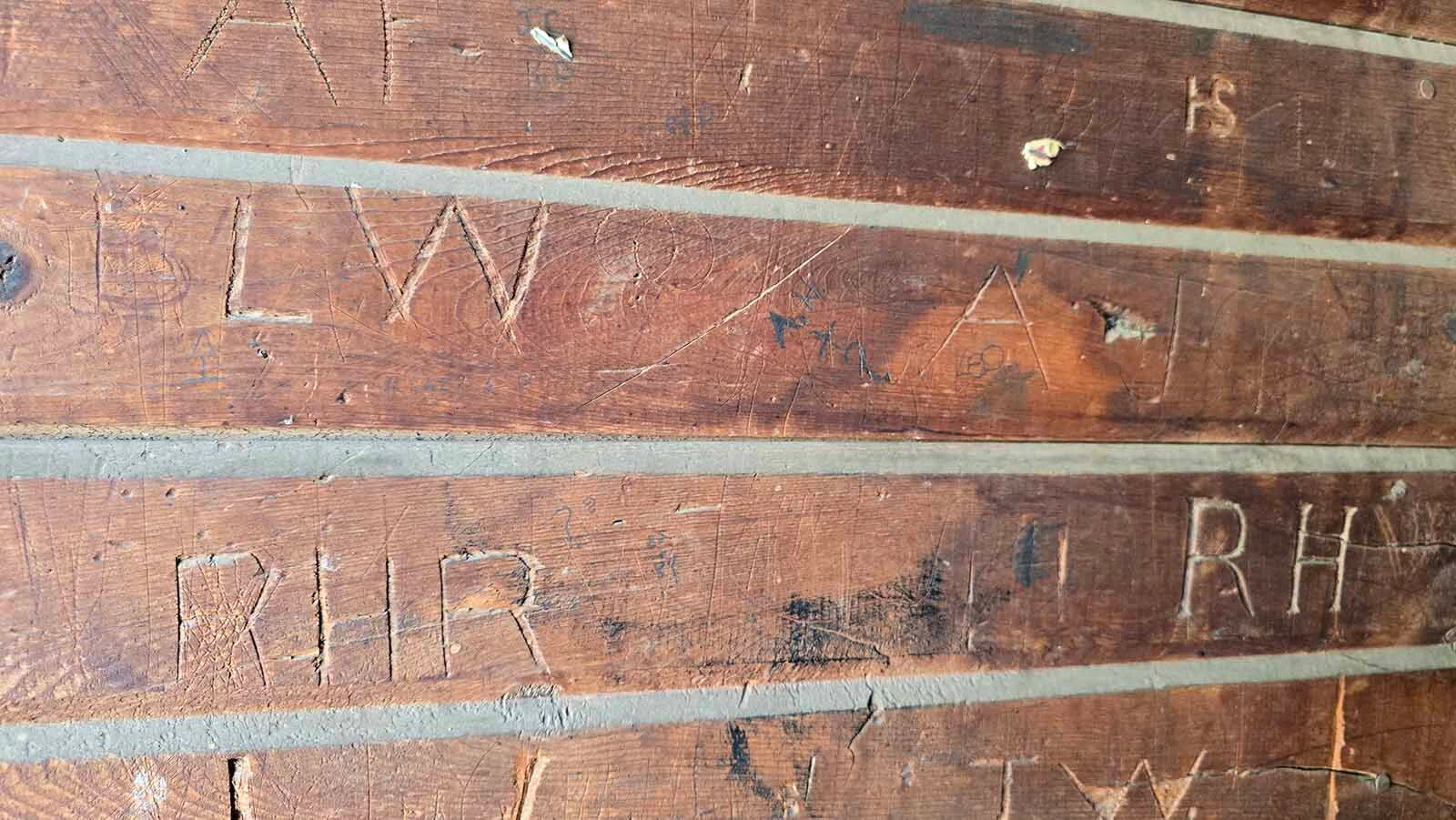 Initials carved into the walls at Wyoming Hereford Ranch.