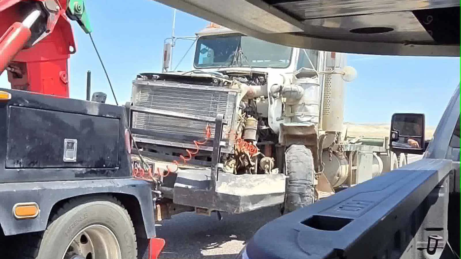 A blown tire on a semitrailer sent it into the opposite lane, sideswiping a GMC Yukon and closing U.S. 20/26 near Shoshoni for more than four hours Wednesday, stranding motorists in near 100-degree heat. 