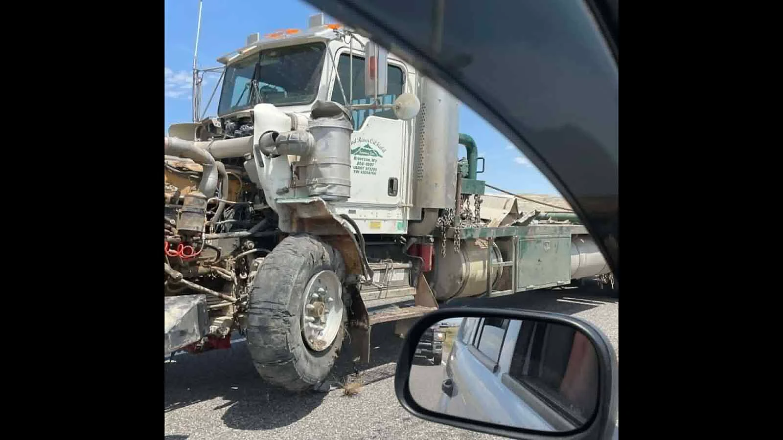 A blown tire on a semitrailer sent it into the opposite lane, sideswiping a GMC Yukon and closing U.S. 20/26 near Shoshoni for more than four hours Wednesday, stranding motorists in near 100-degree heat. 
