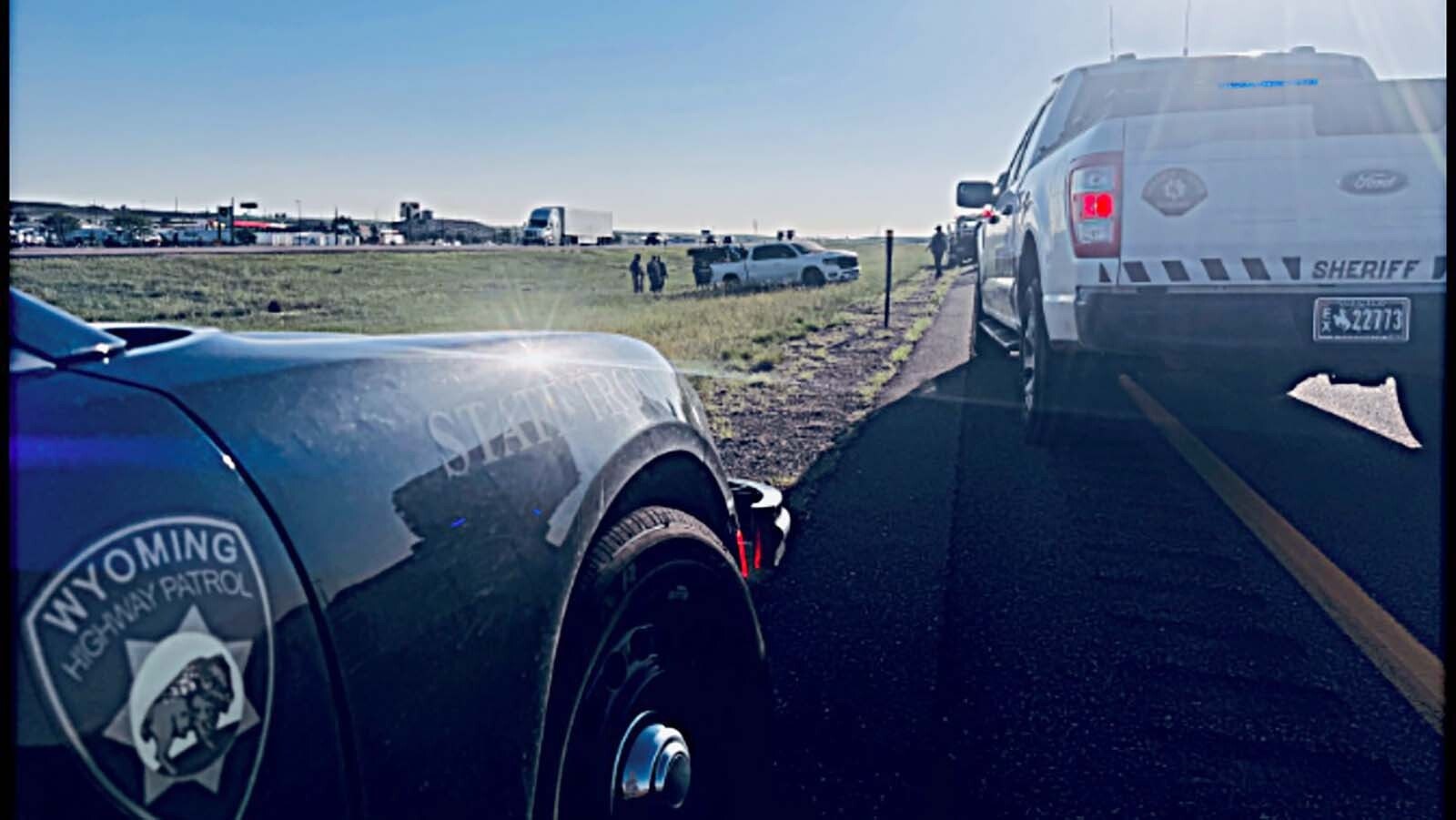 A Wyoming Highway Patrol Trooper rolled his vehicle Friday morning, June 20, 2025, near Cheyenne while grappling the truck wheel of a homicide suspect who was fleeing Colorado, the local sheriff says.