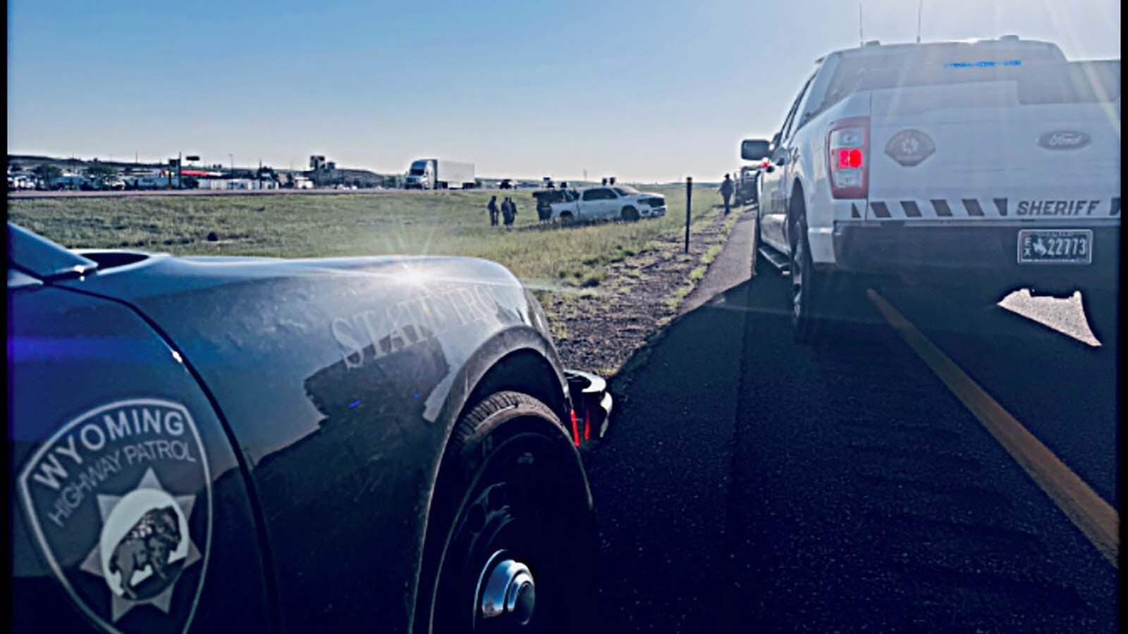 A Wyoming Highway Patrol Trooper rolled his vehicle Friday morning, June 20, 2025, near Cheyenne while grappling the truck wheel of a homicide suspect who was fleeing Colorado, the local sheriff says.