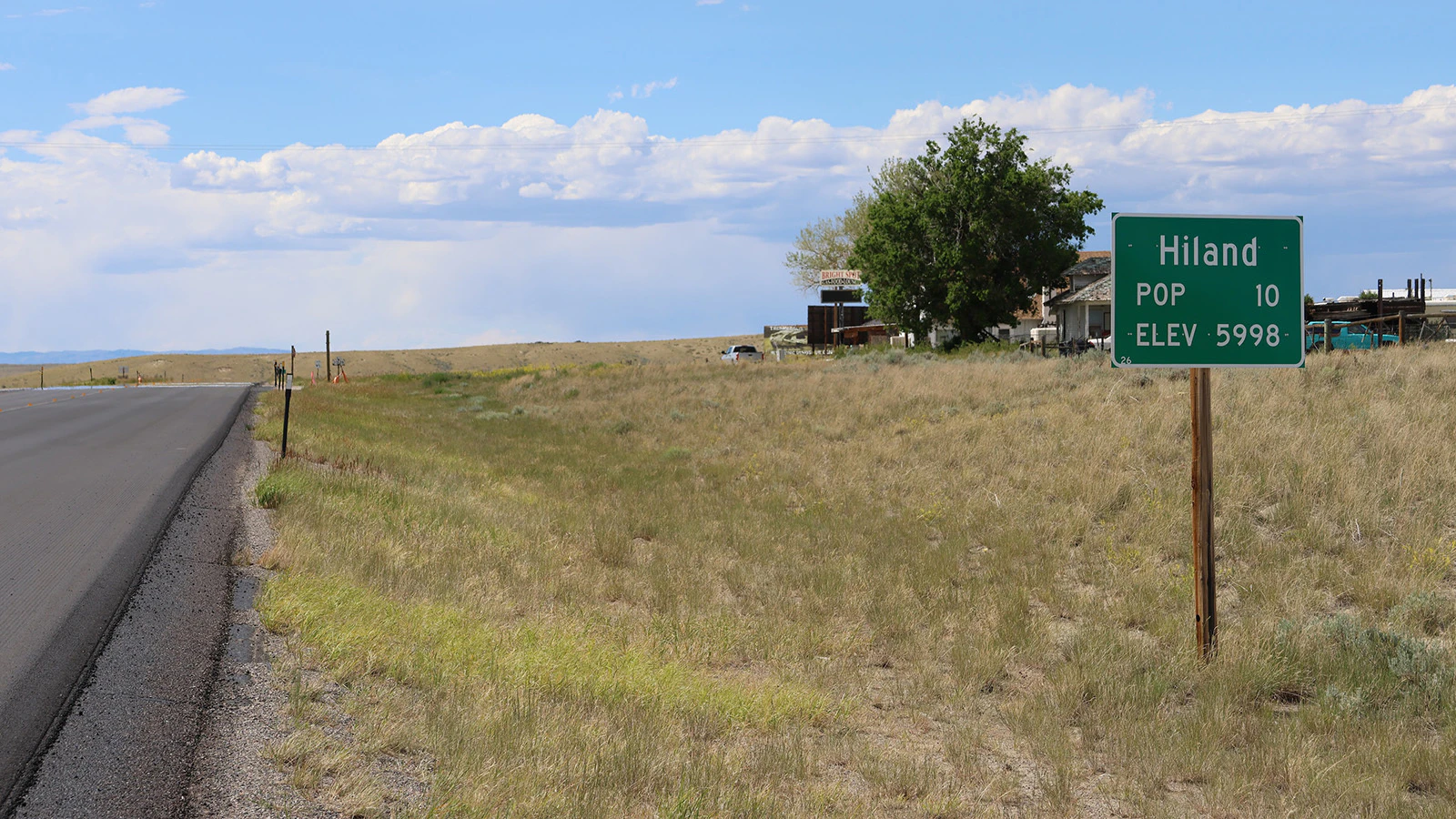 The sign for Hiland, Wyoming, estimates a population of 10. It is about right on target.