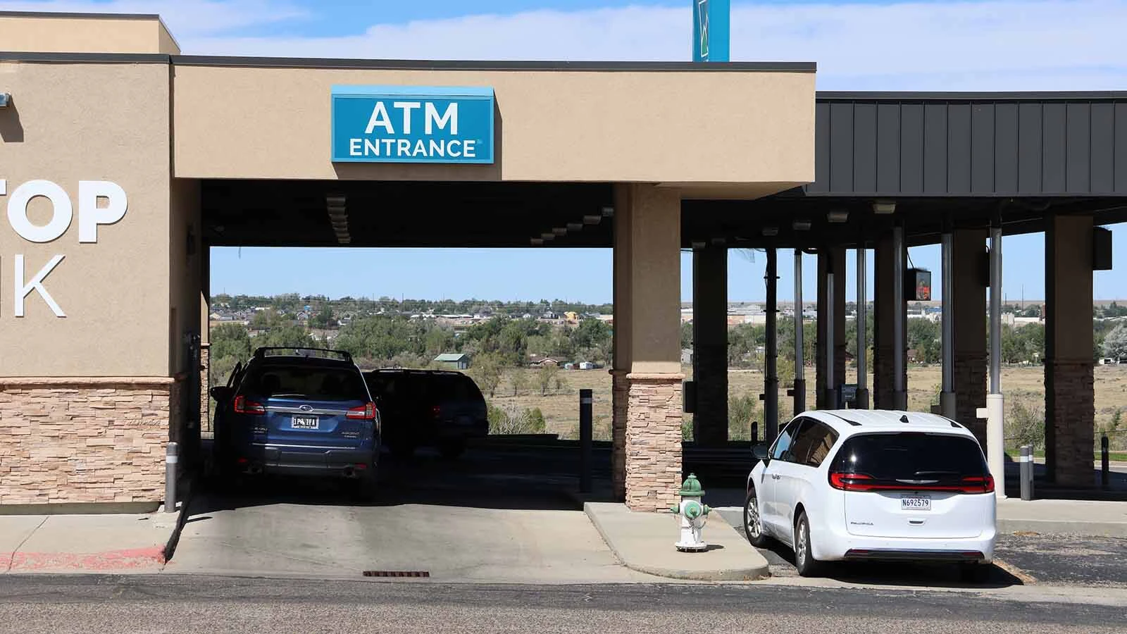 Customers line up at the drive-thru at a Hilltop Bank branch in Casper.