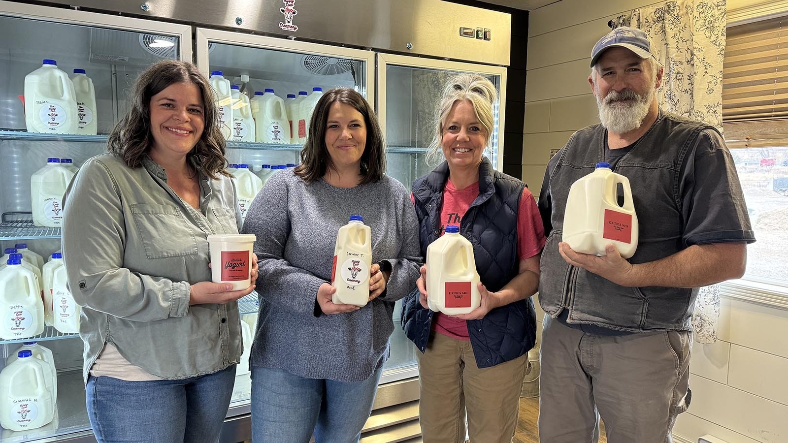 Maggie Haron, Sadie Howard, Mary Nelson and Mark Nelson proudly pose with dairy products from Hippie Cow Creamery.