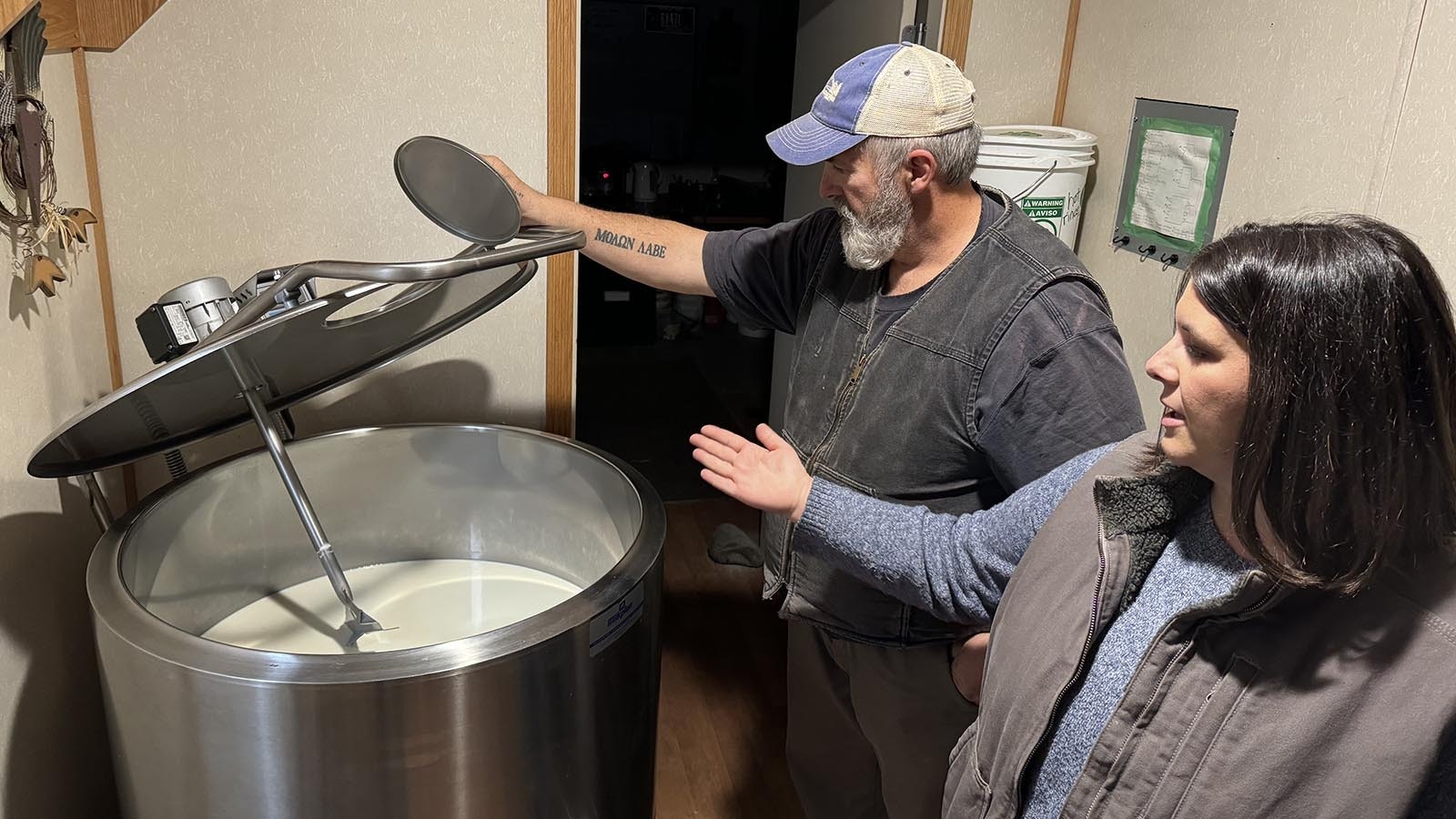 Mark Nelson and Maggie Haron with the 30-gallon vat where the raw milk from their cows is kept at a constant 38 degrees. Hippie Cow Creamery operates on a "farm to table" mentality, getting raw milk from cows to customers as simply and safely as possible without pasteurization.