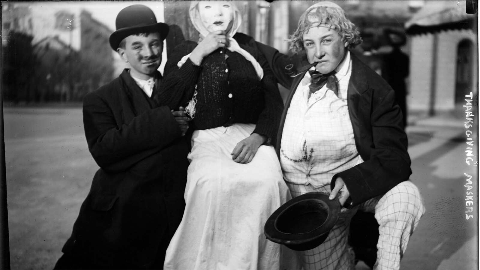 Thanksgiving “maskers" would run around cities, such as Cheyenne, dressed as beggars and silly characters. They would play at begging for alms and, if not given pennies, nickels or candy from adult pedestrians, would whack them with a sock full of flour and toot their horns in their victim’s ears, like in this photo circa 1910.