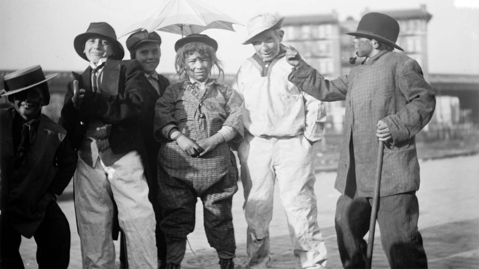 Thanksgiving “maskers" would run around cities, such as Cheyenne, dressed as beggars and silly characters. They would play at begging for alms and, if not given pennies, nickels or candy from adult pedestrians, would whack them with a sock full of flour and toot their horns in their victim’s ears, like in this photo circa 1910.