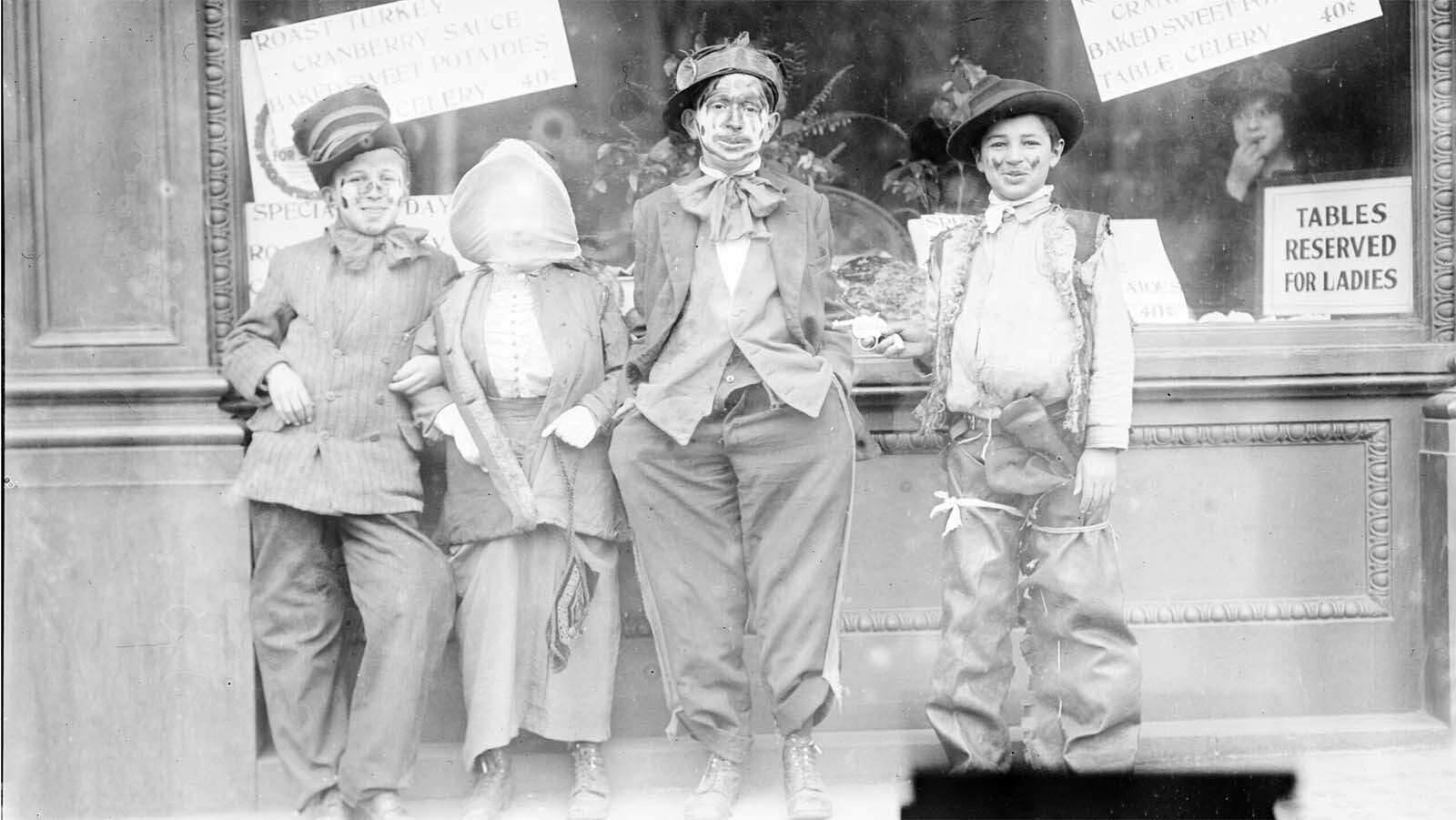 Thanksgiving “maskers" would run around cities, such as Cheyenne, dressed as beggars and silly characters. They would play at begging for alms and, if not given pennies, nickels or candy from adult pedestrians, would whack them with a sock full of flour and toot their horns in their victim’s ears, like in this photo circa 1910.