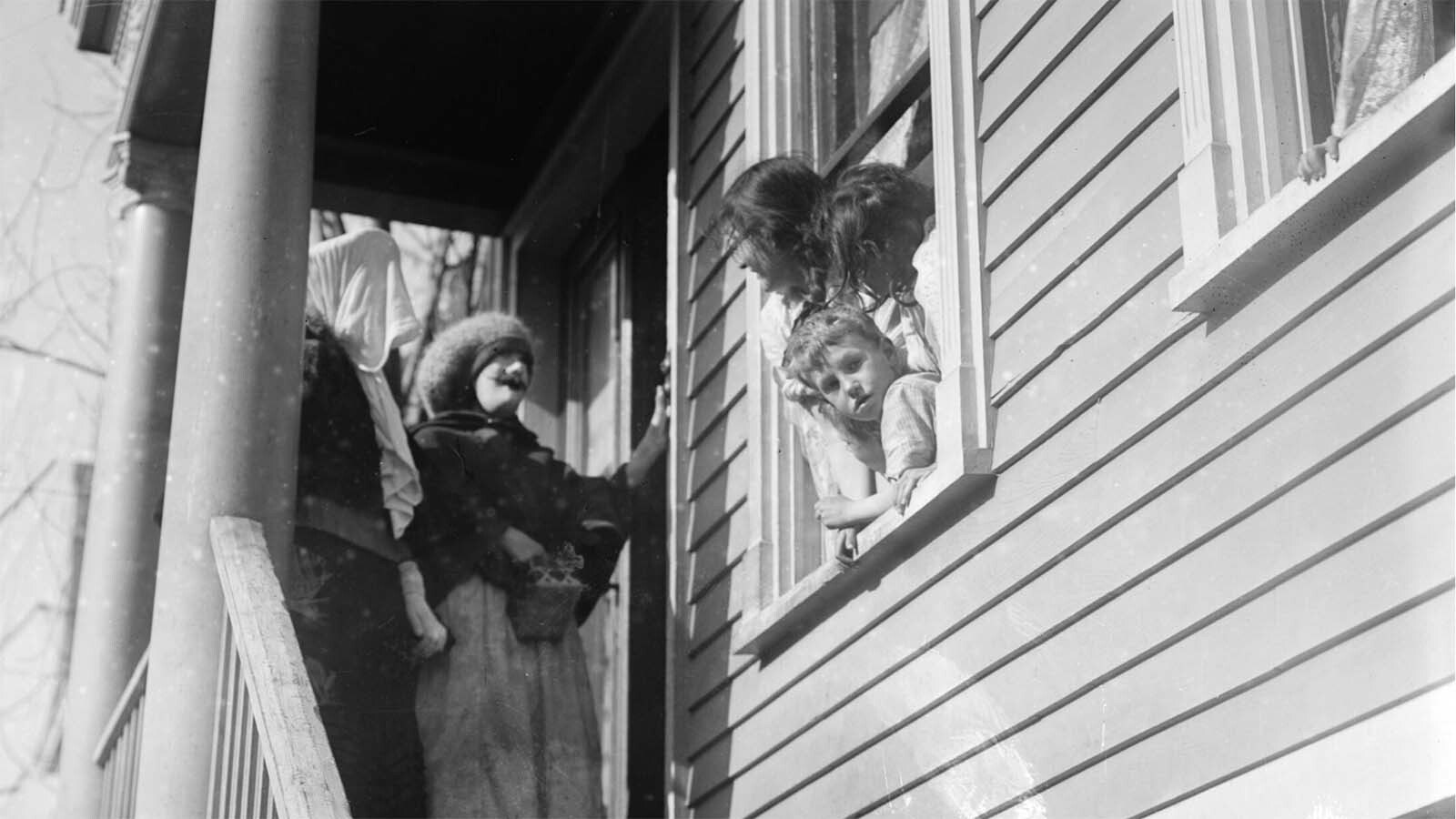 Thanksgiving “maskers" would run around cities, such as Cheyenne, dressed as beggars and silly characters. They would play at begging for alms and, if not given pennies, nickels or candy from adult pedestrians, would whack them with a sock full of flour and toot their horns in their victim’s ears, like in this photo circa 1910.