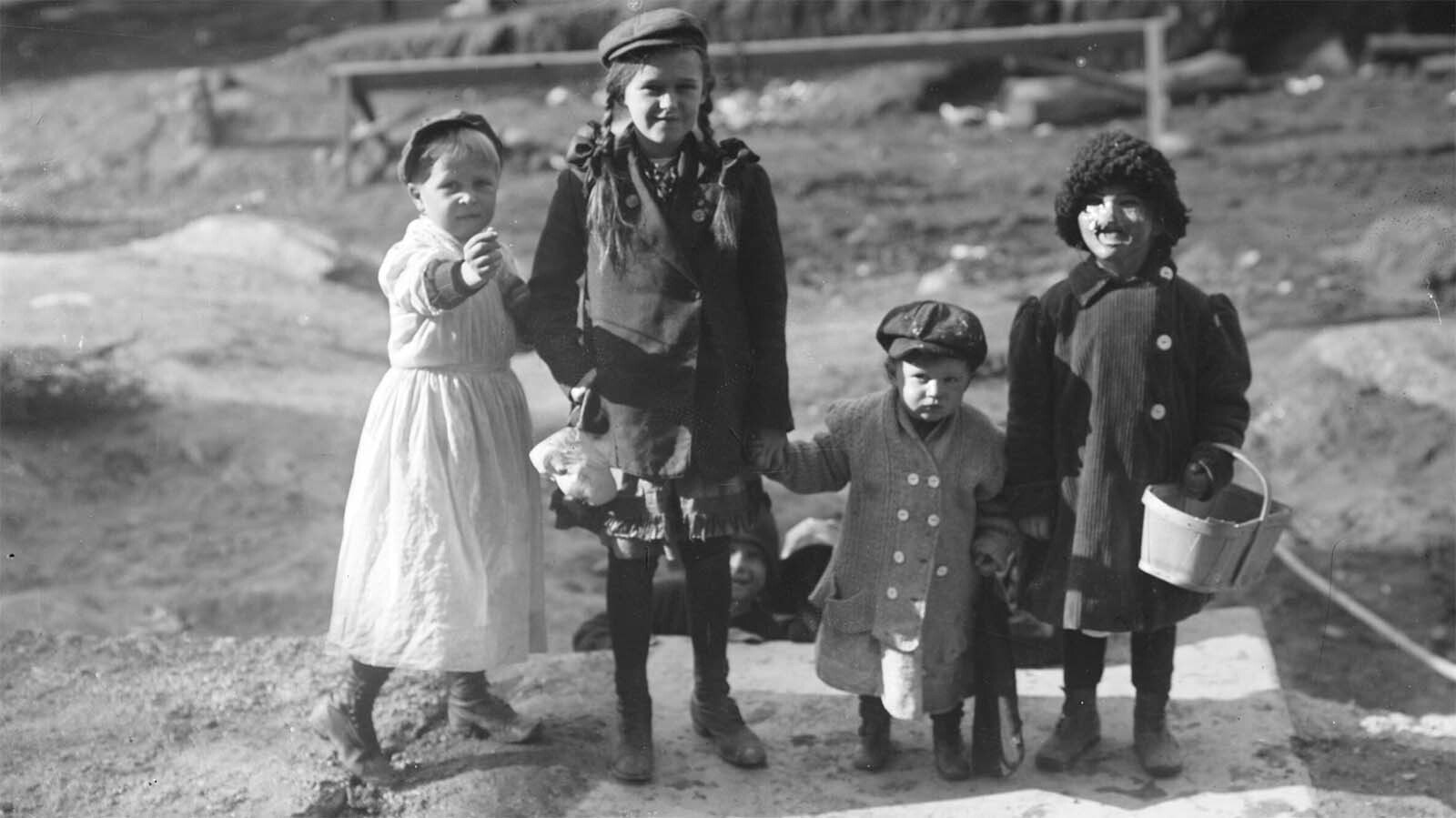 Thanksgiving “maskers" would run around cities, such as Cheyenne, dressed as beggars and silly characters. They would play at begging for alms and, if not given pennies, nickels or candy from adult pedestrians, would whack them with a sock full of flour and toot their horns in their victim’s ears, like in this photo circa 1910.