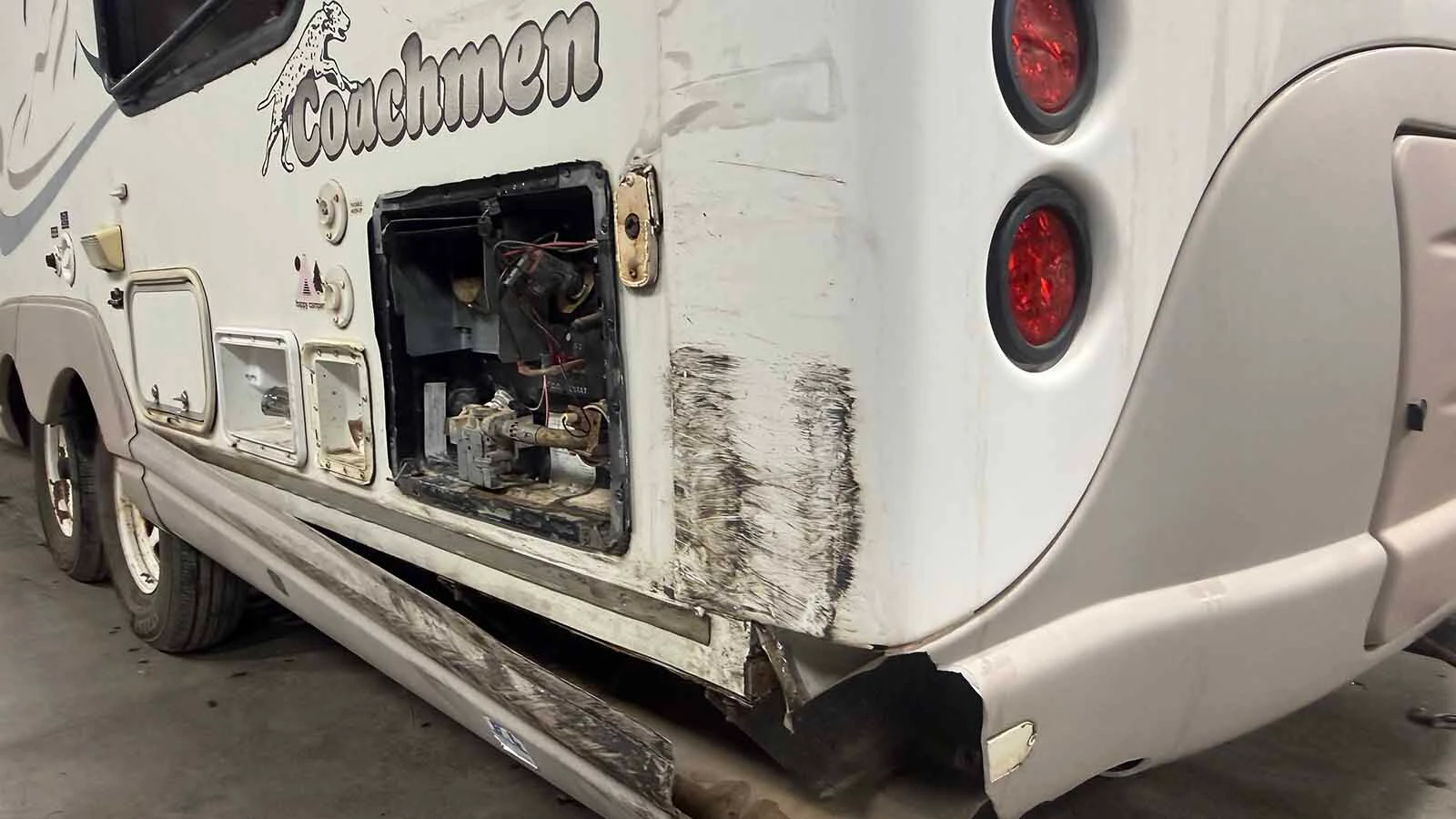 Scrapes, torn panels and an exposed utility compartment show damage to the family’s camper after Friday night’s reported hit-and-run southwest of Laramie.