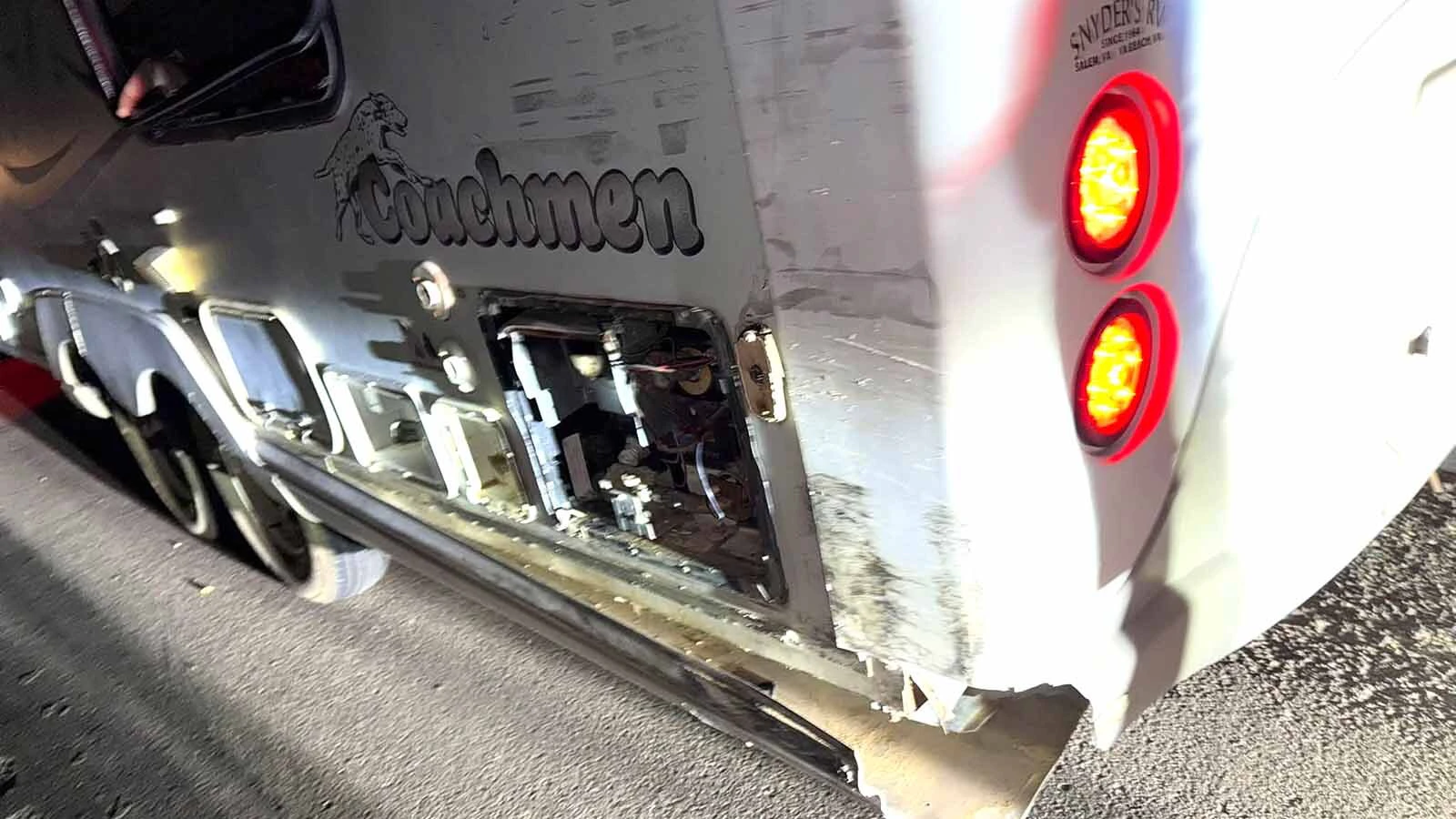 The collision tore open utility compartments and damaged the lower exterior of the camper, leaving Tabb and his family trying to patch the home they still live in.