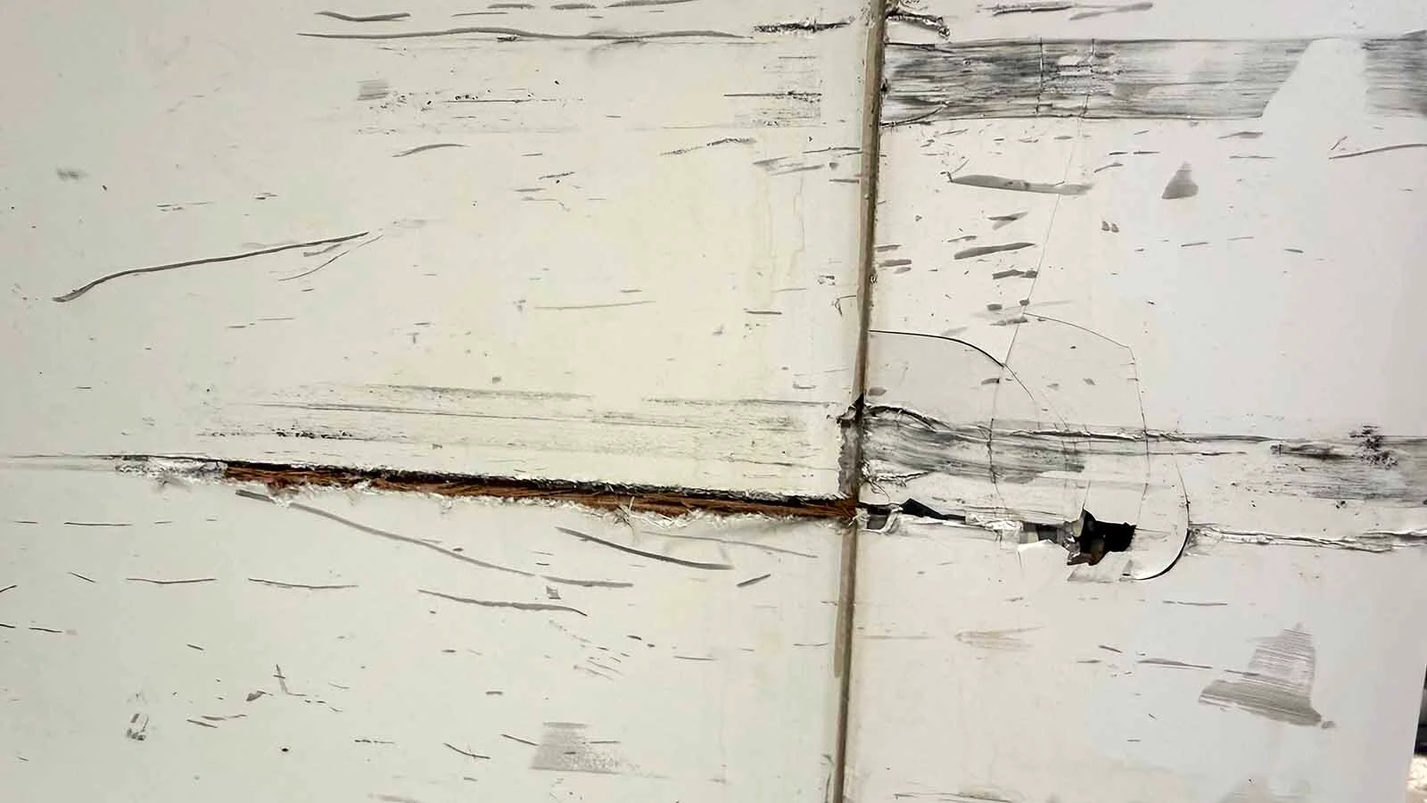 The collision tore open utility compartments and damaged the lower exterior of the camper, leaving Tabb and his family trying to patch the home they still live in.