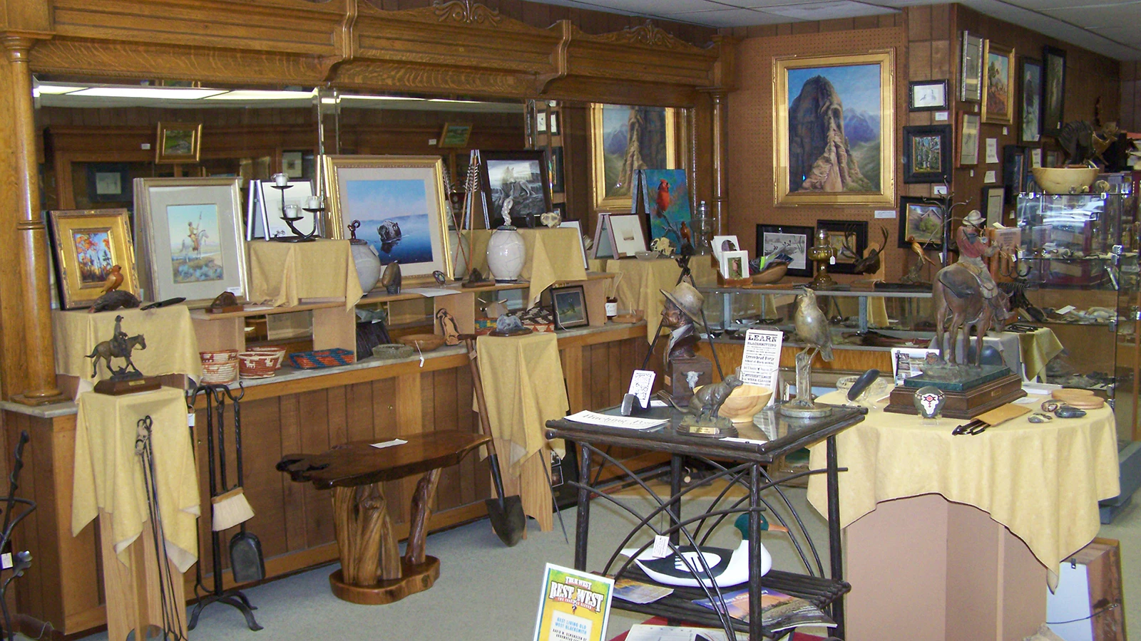 Opened in November 1993 on Main Street just south of Crazy Woman Square, the Hitching Post Art Gallery showcased work from many area artists, along with a large selection of gifts and books, and cigars and tobacco. 