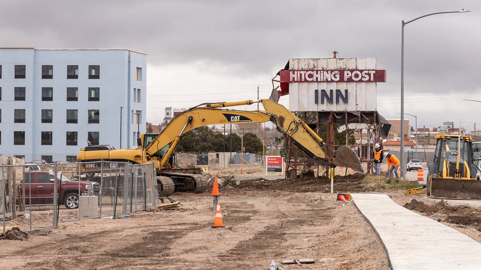 The iconic Hitching Post Inn sign on Lincolnway in Cheyenne is dismantled Thursday, May 9, 2024, perhaps comign down for good.
