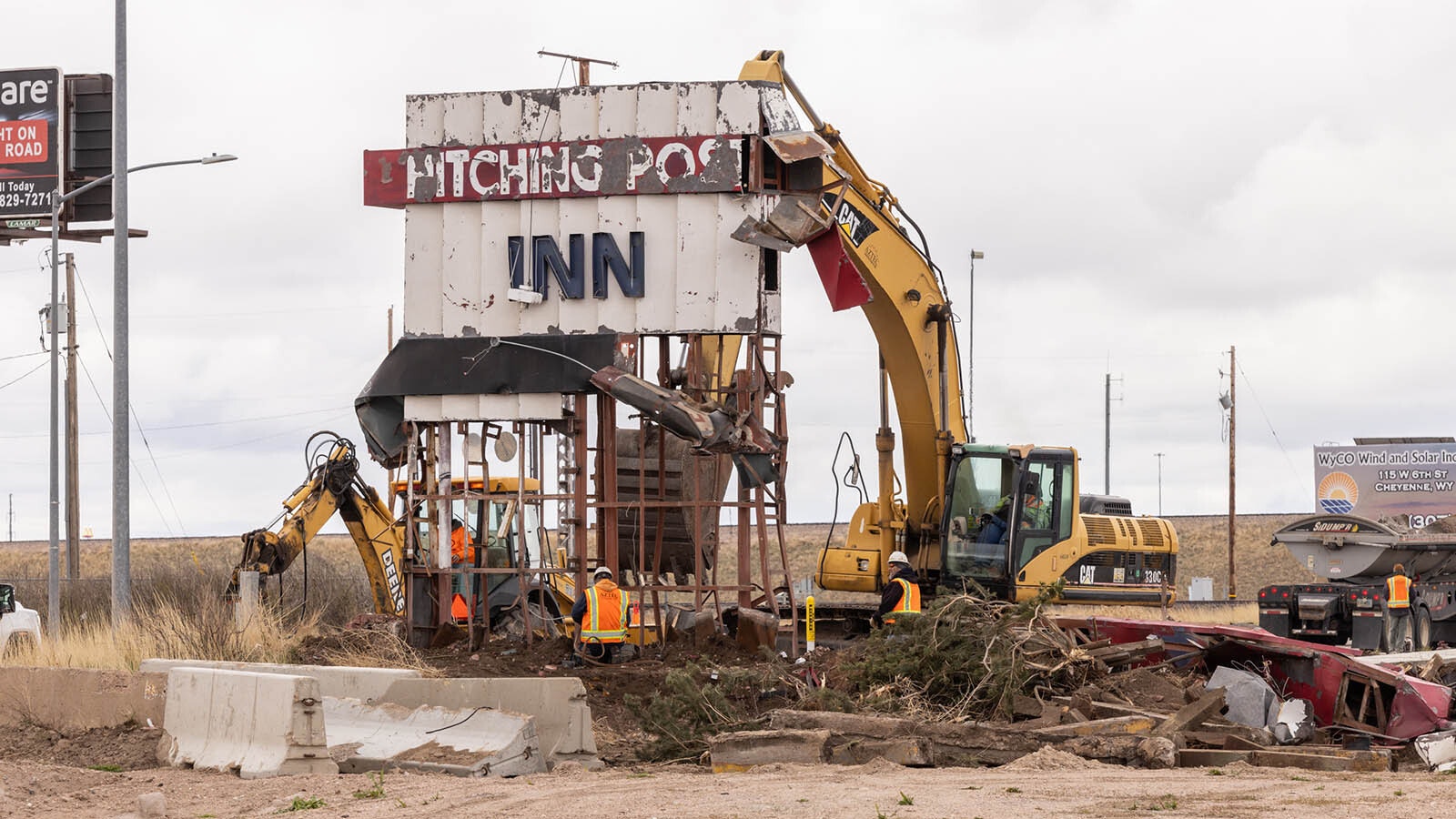 The iconic Hitching Post Inn sign on Lincolnway in Cheyenne is dismantled Thursday, May 9, 2024, perhaps comign down for good.