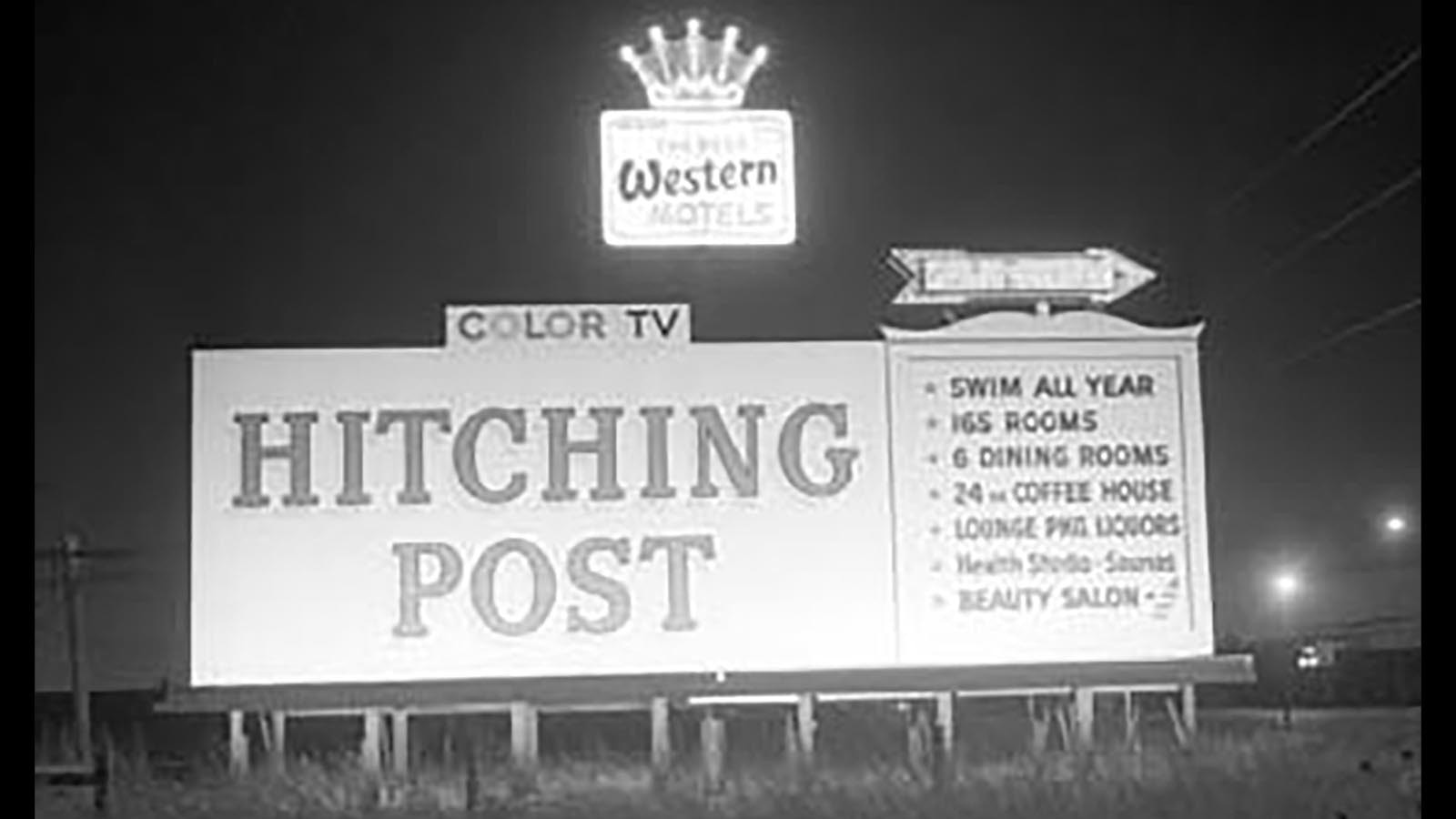 A billboard pointing travelers to Cheyenne's Hitching Post Inn.