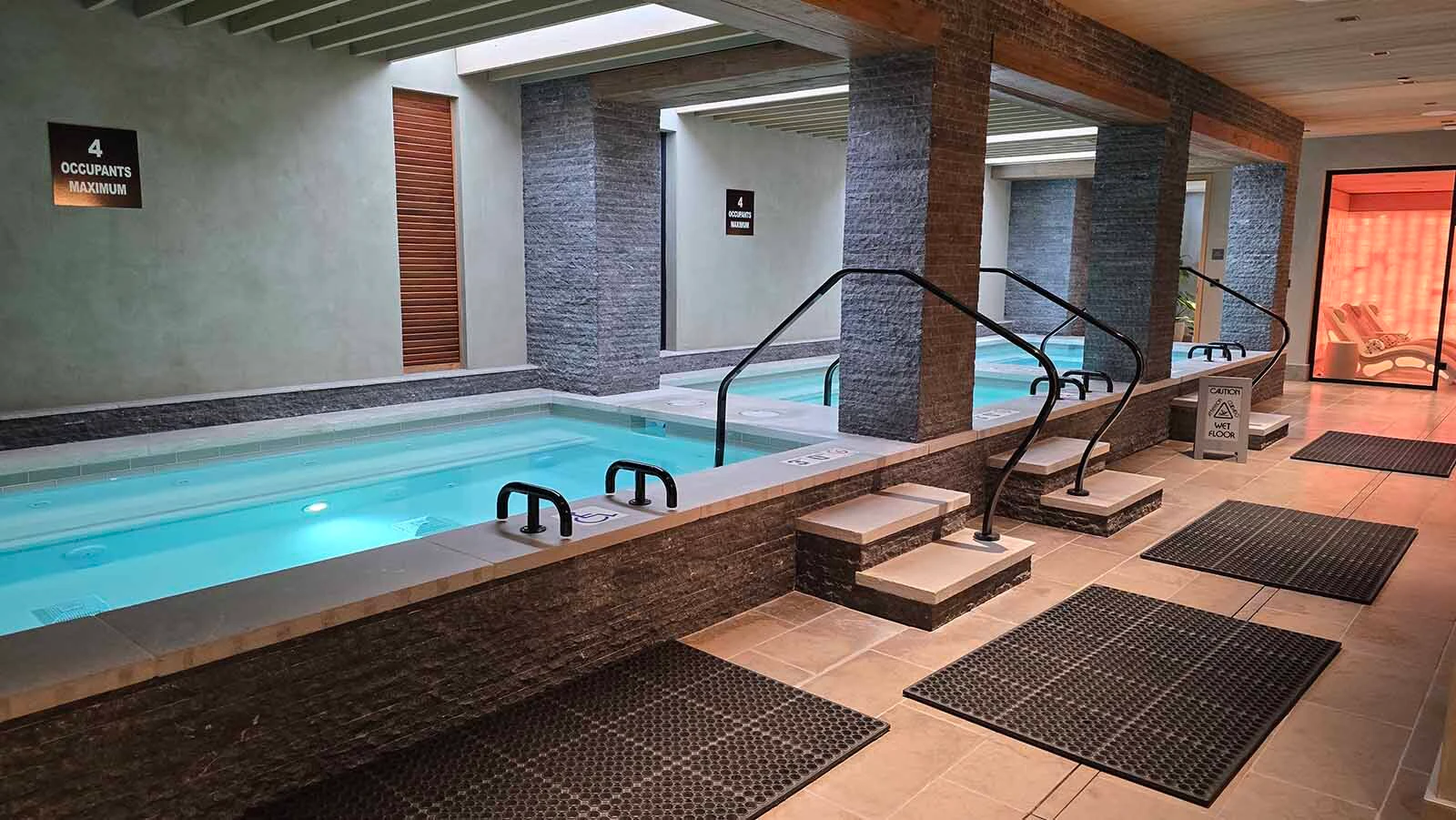 A series of thermal pools at Hoback Club have different temperatures. At the end of the row is a salt room.
