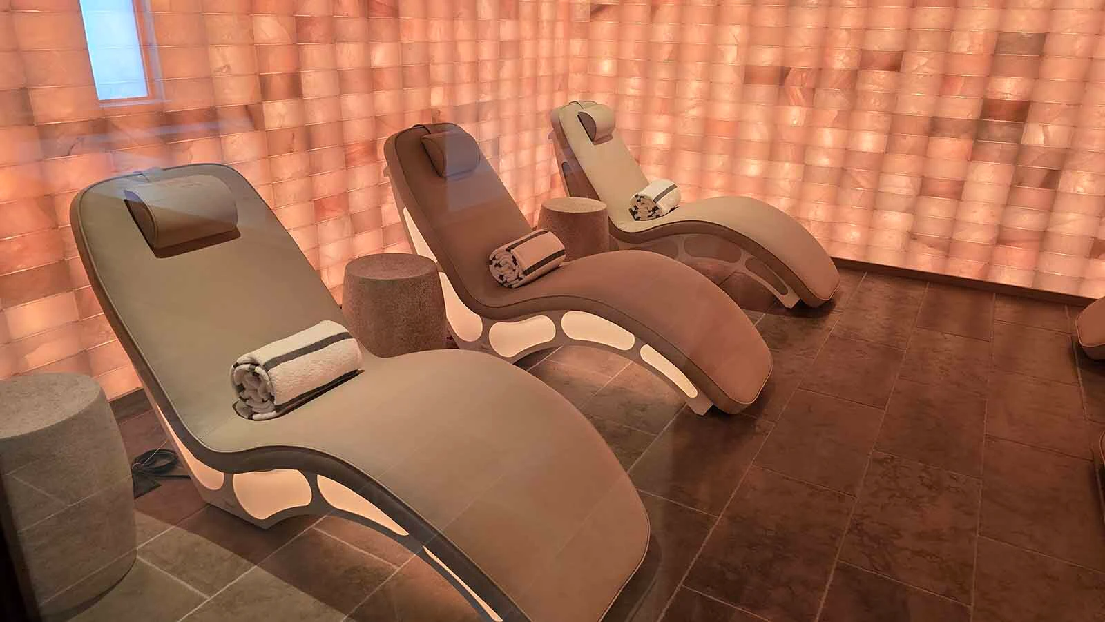 The walls in the salt room are floor-to-ceiling with Himalayan salt blocks. The real work though is a machine that can't be seen but which blows salt particulates into the air.