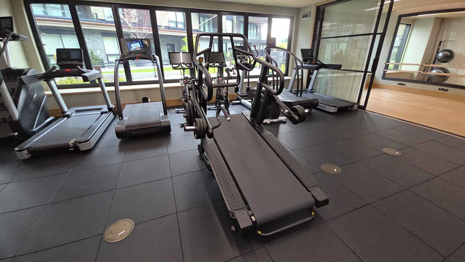 This treadmill includes weights so athletes can both run and lift weights at the same time.
