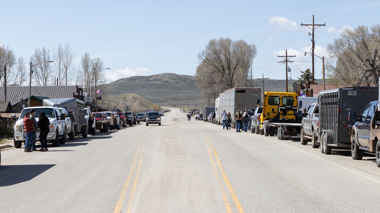 Cattle trailers and vehicles were parked in front of the Green River Bar in Daniel, Wyoming, for the Hogs For Hope motorcycle rally on May 26, 2024.