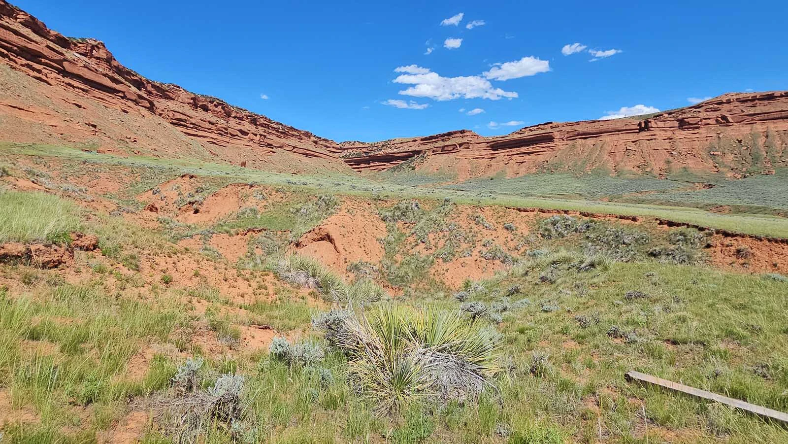 A tiny insignificant white speck in this photo is actually a 12-foot by 15-foot flat, white rock, and marks the location of the Hole in the Wall.