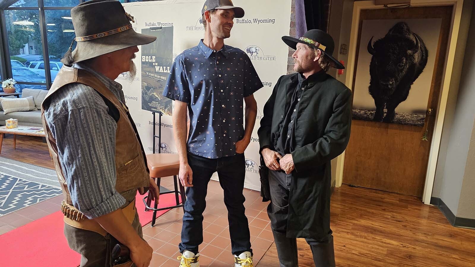 Stephen Howard Tucker, center, chats with living historian Nic Skalicky, right, about the Hole in the Wall documentary Tucker recently finished making.