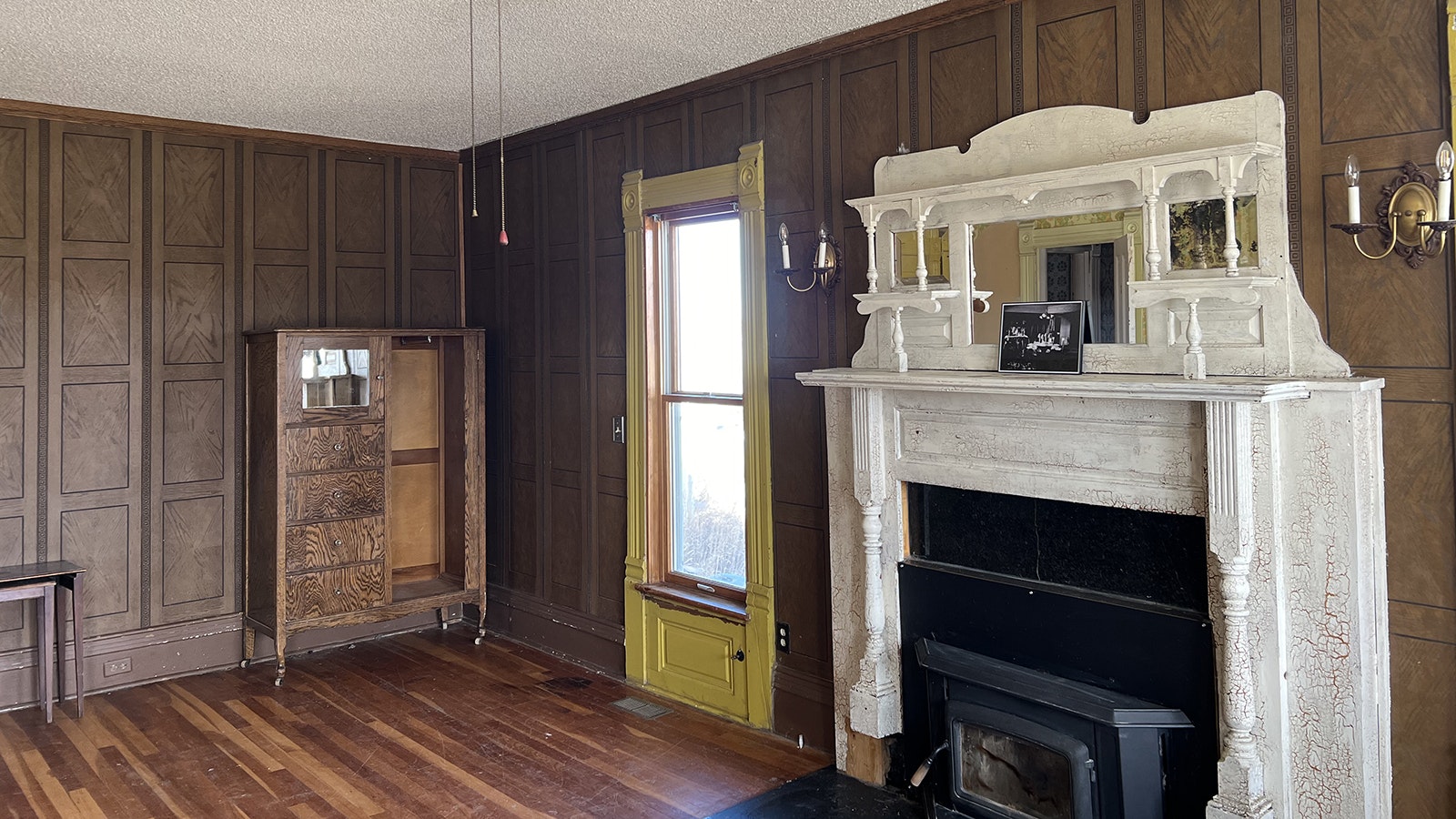 Although Laramie’s Holliday House has gone through alterations since it was first built in 1878, many parts of it, like the front room fireplace mantle, are original.