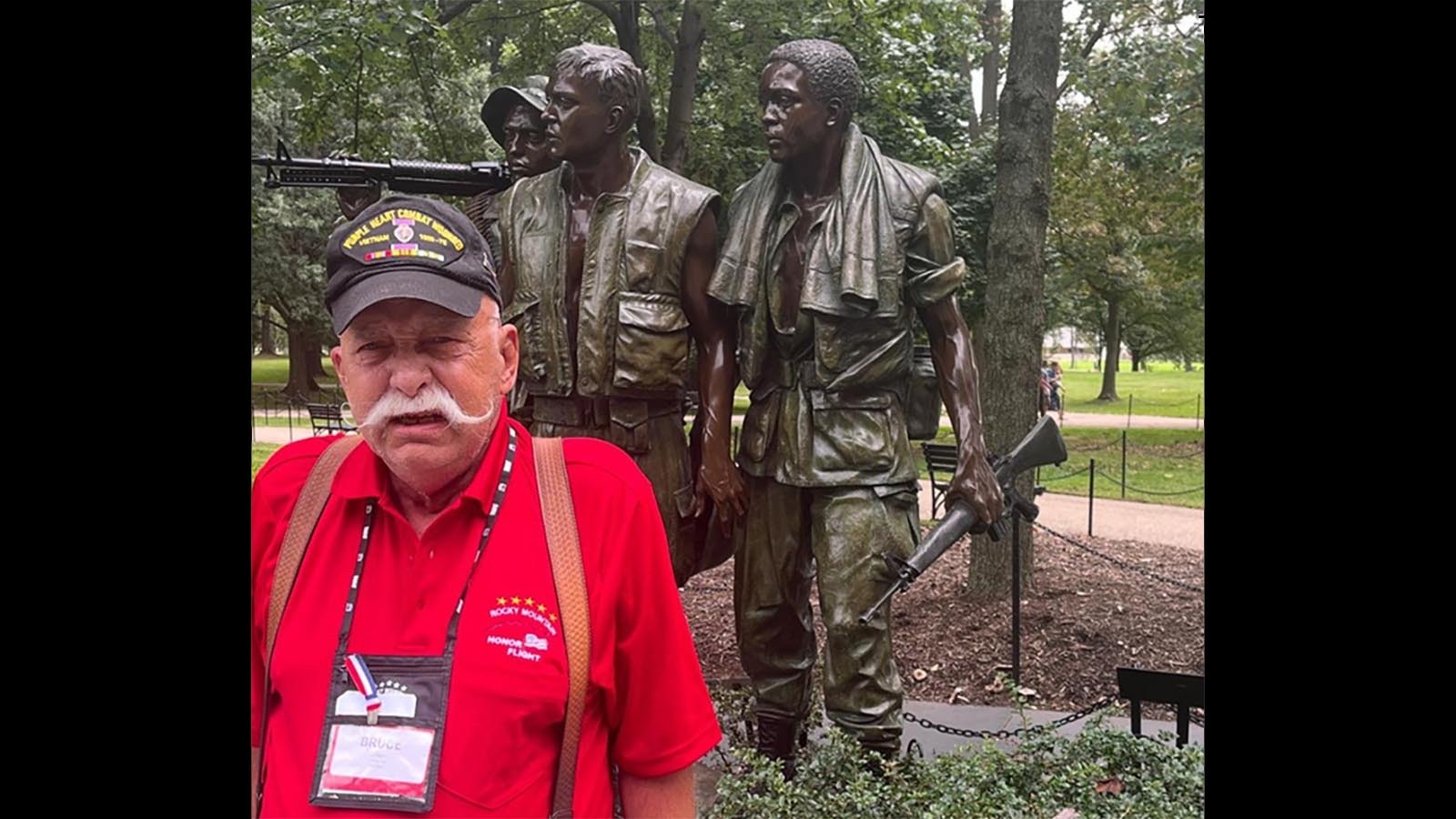 Bruce Leikam of  Cheyenne pays tribute at the Vietnam Veterans Memorial.