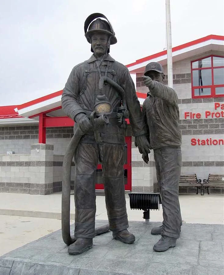 The sculpture of “The Volunteer” as it stands outside the current fire station in Powell.