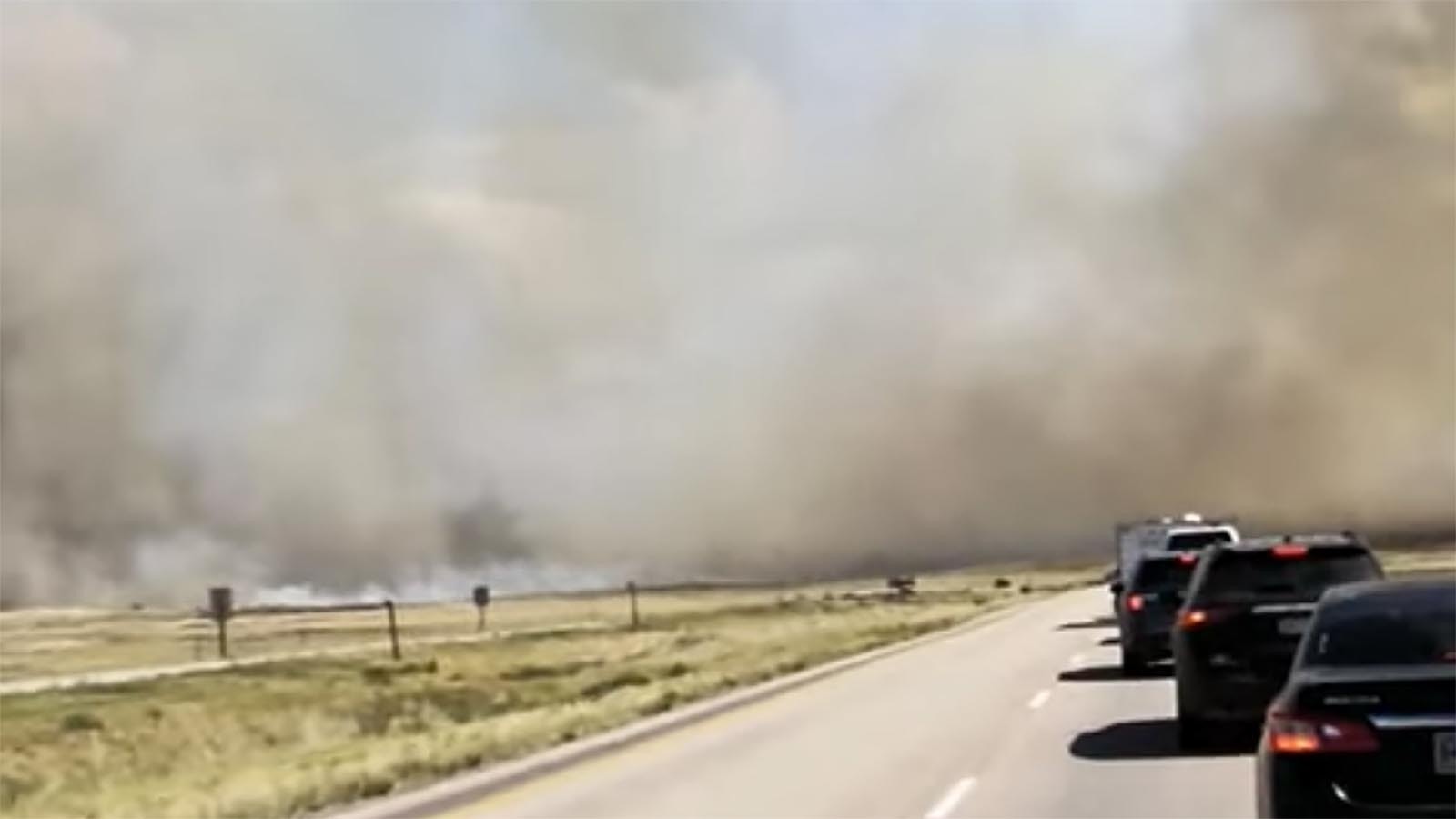 The Horse Draw Fire in Johnson County flared up Wednesday, forcing a closure of Interstate 90 and evacuations. In this still shot from a short video posted by YouTube user @bec4337, huge plumes of smoke are ahead as cars are stranded on a closed I-90.