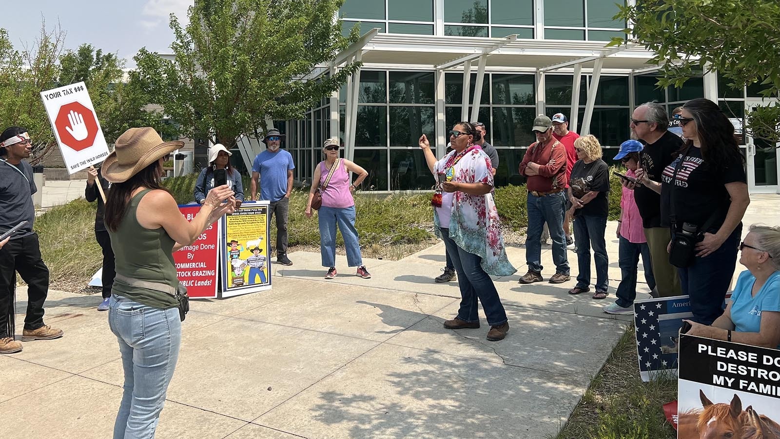 Bobbi Shogutsie of the Eastern Shoshone Tribe, Wind River Reservation, talks to protestors Monday outside the Bureau of Land Management Rock Springs field office.