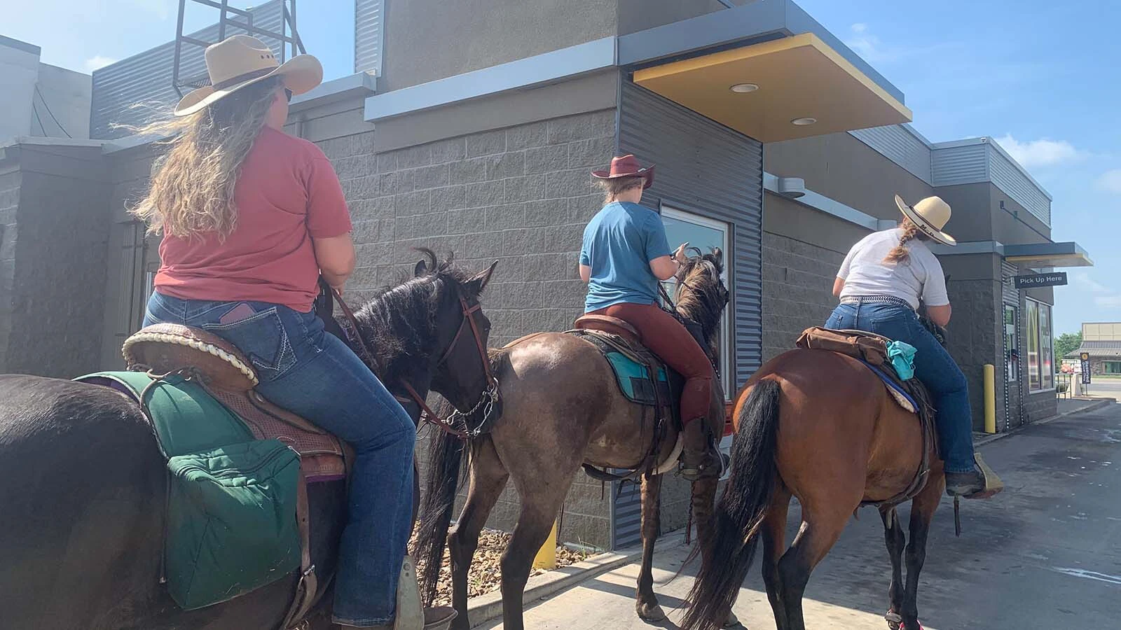 When Lisanne Fear sat down to write a suicide note, she couldn't bring herself to part with a mustang named Phineas. That decision led to the Pinedale, Wyoming, woman's 5,000-mile ride across the U.S. Here, she rides through a drive-thru in Missouri.