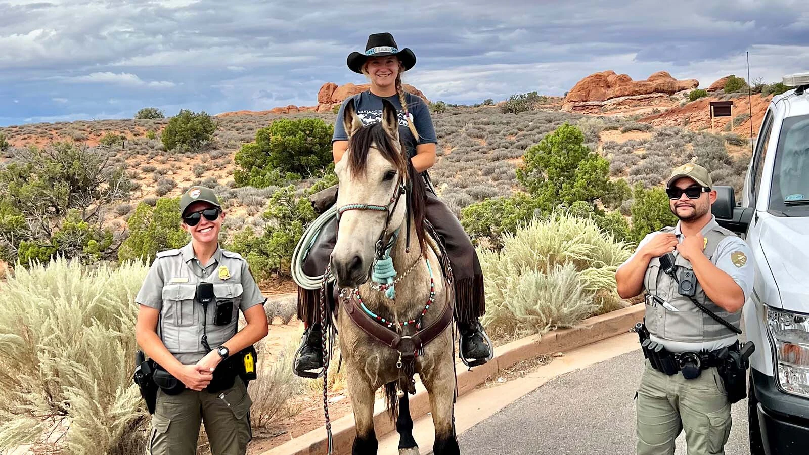 When Lisanne Fear sat down to write a suicide note, she couldn't bring herself to part with a mustang named Phineas. That decision led to the Pinedale, Wyoming, woman's 5,000-mile ride across the U.S. Through Arches National Park, she got an escort by park rangers.