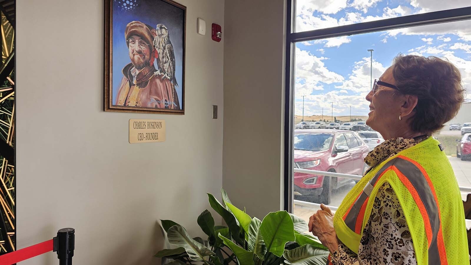 Patty Hoskinson talks about the Hoskinson Health & Wellness Clinic that her son Charles Hoskinson helped build in Gillette. She is looking at photo of Charles as she's speaking.