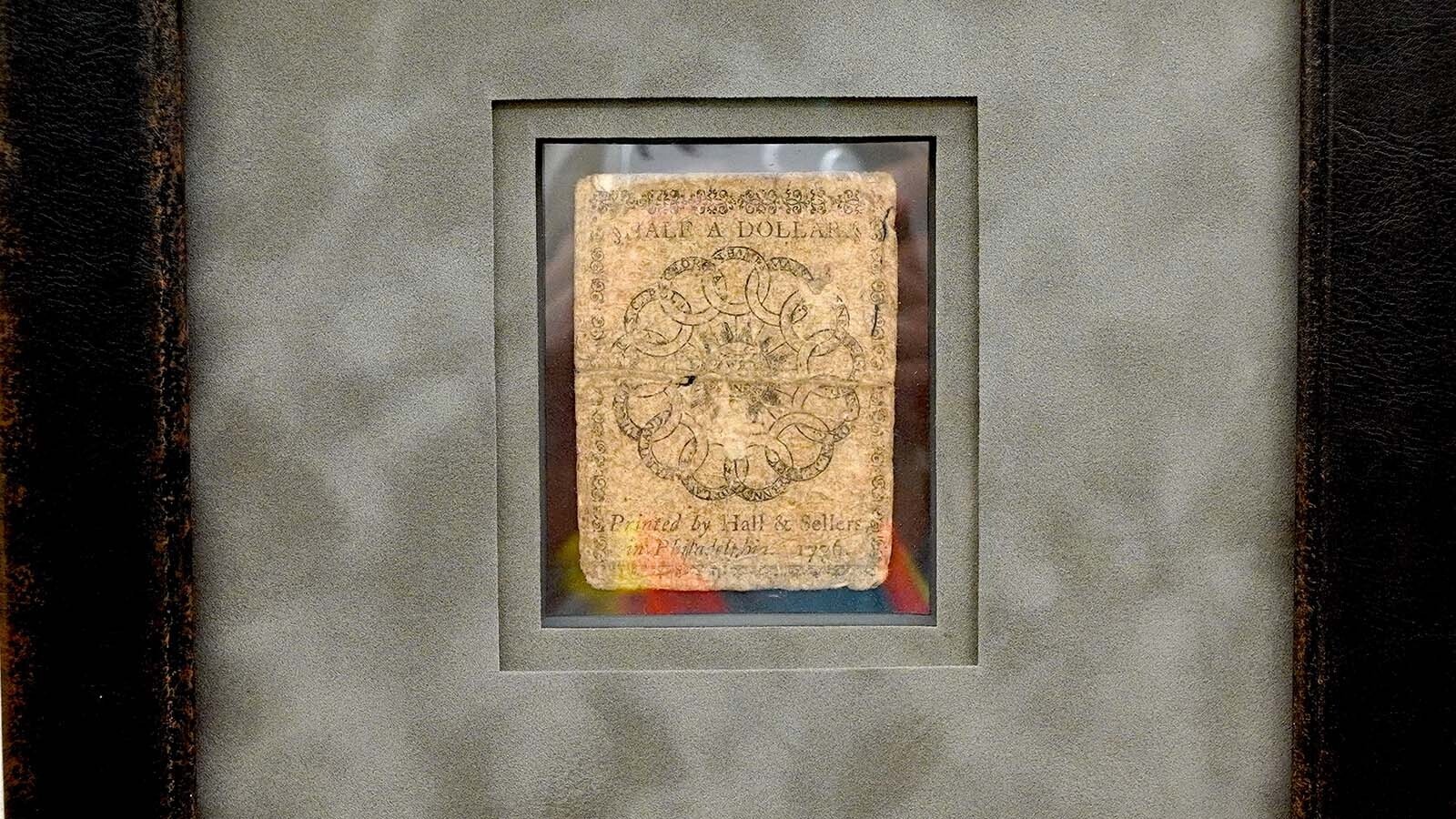 A Continental half-dollar bill hangs on the wall of the Hoskinson Health & Wellness Clinic in Gillette.