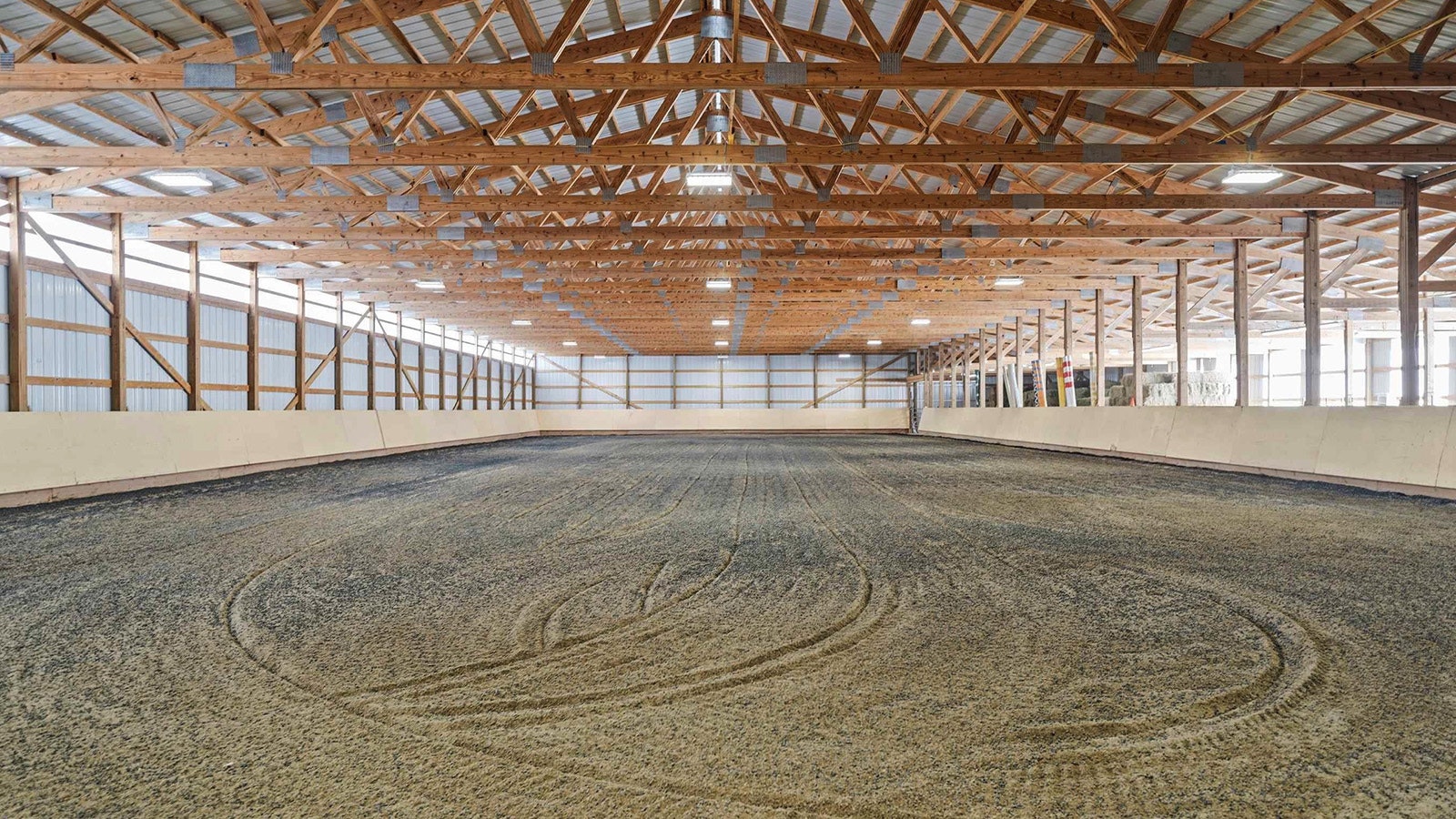 The real estate specialization niche of horse properties is something that's especially helpful in rural states like Wyoming, where homebuyers are looking for more than great living ammenities for themselves. They're also looking for their horses. This property also features a large hay barn, arena and other tack and on-site living areas to care for horses.