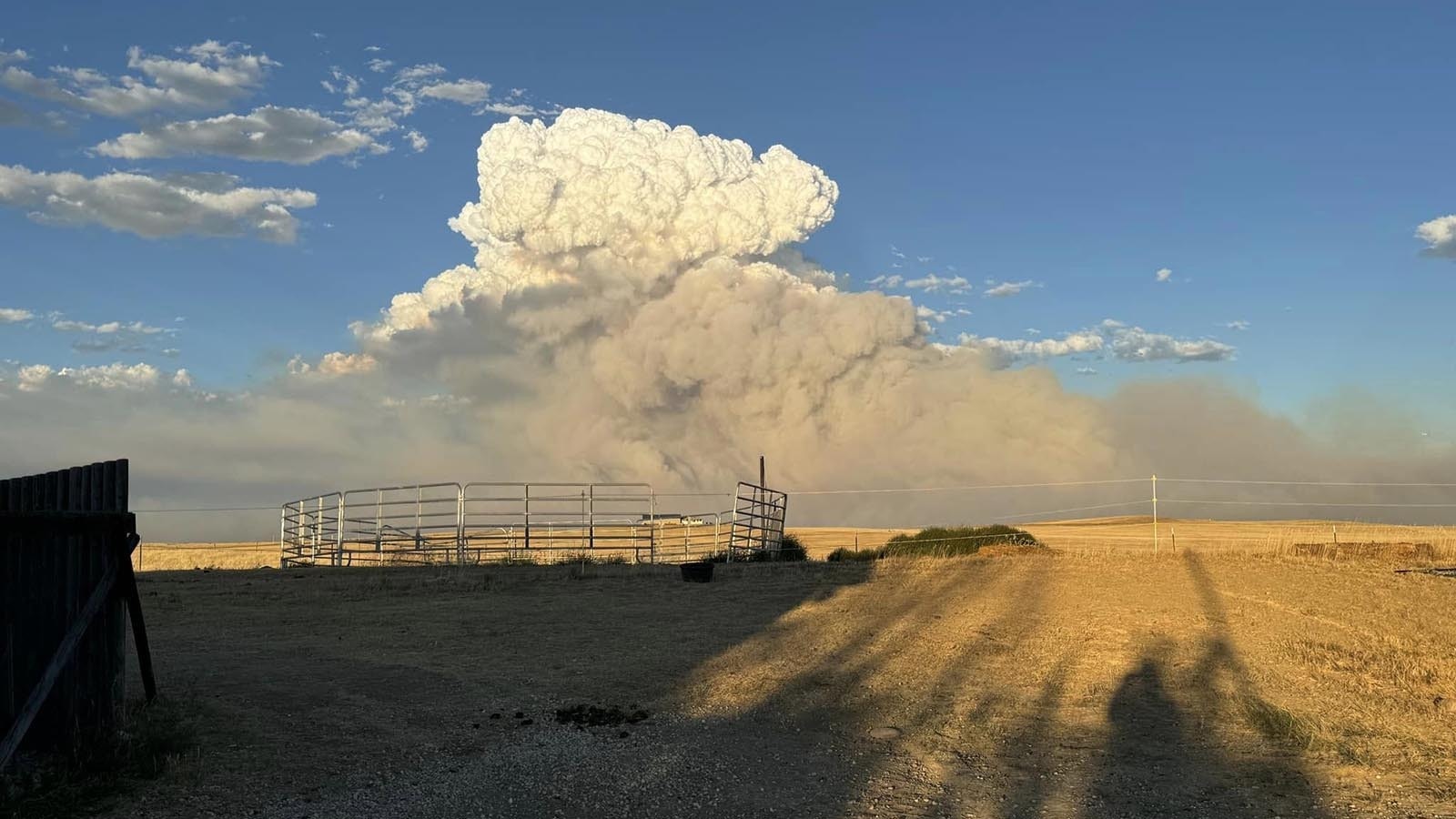 Huge plumes of smoke from the House Creek Fire as it burns past the home of Ashley Malcom near Buffalo, Wyoming. Malcom said the fire moved fast, but thankfully missed her property.