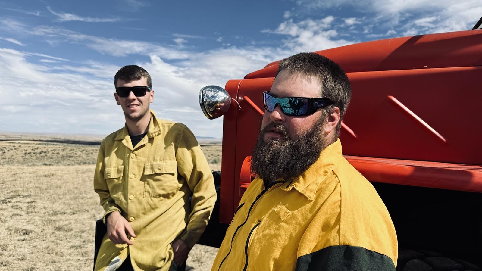 On left, Cody Edgeington and Drew Gibson of the Bar Nunn Fire Department in Wyoming, were stationed on Friday off Buffalo Sussex Cutoff Road to watch for flare ups from the House Draw Fire.