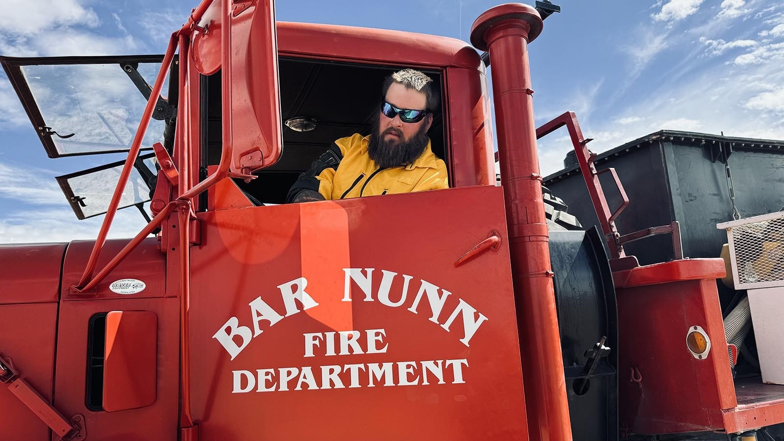 Firefighter Cody Edgeington of the Bar Nunn Fire Department in Wyoming, explained that he’s sitting in his “Big Boy” truck watching for flareups from the House Draw Fire off Buffalo Sussex Cutoff Road.