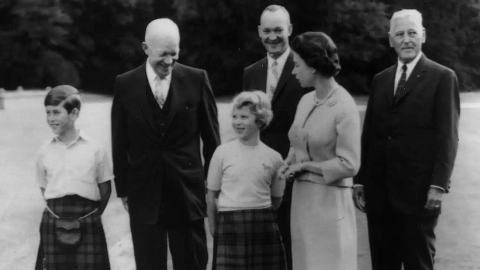 When President Dwight Eisenhower, left, visigted with Queen Elizabeth and the royal family in England, his personal physician Dr. Howard Snyder, right, was always close at hand. Also pictured are a young Prince Charles and Princess Anne.