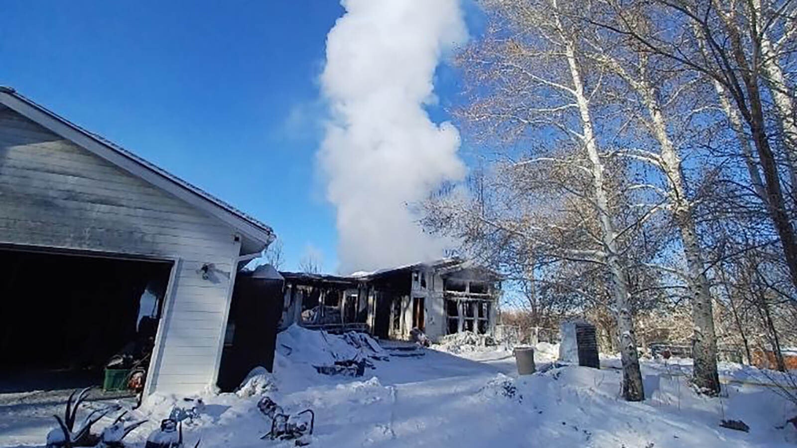 The house was still smoking the day after the accidental, but unsolvable fire that destroyed it Jan. 12.