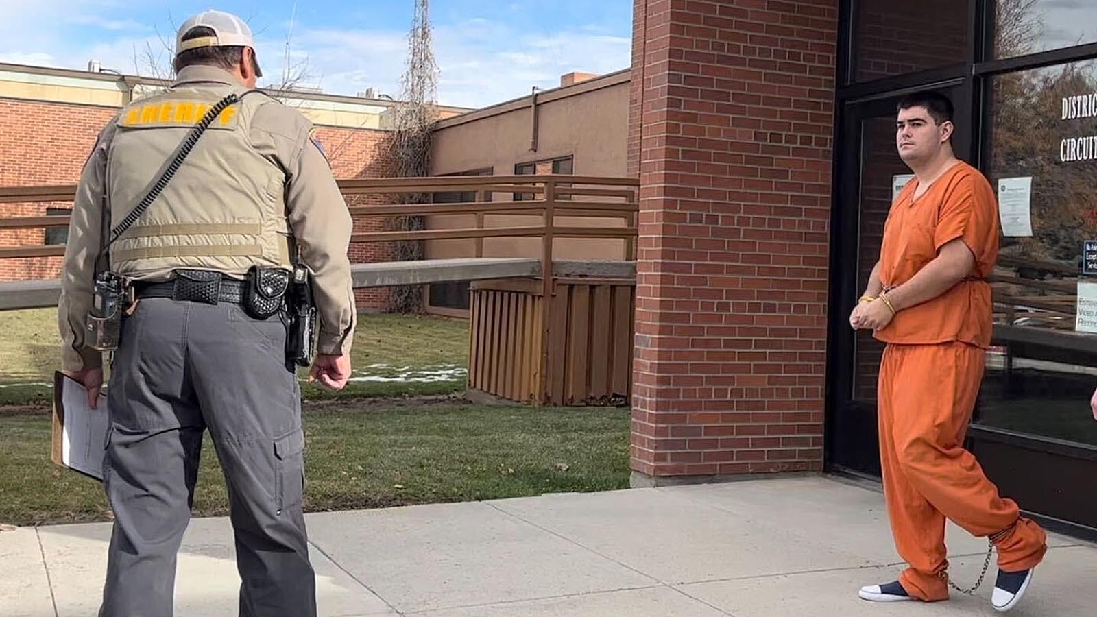 Hunter DeVries, right, walks down the steps of the Fremont County District Court moments after pleading guilty Tuesday, Nov. 12, 2024, to molesting a child at least four times this past year.