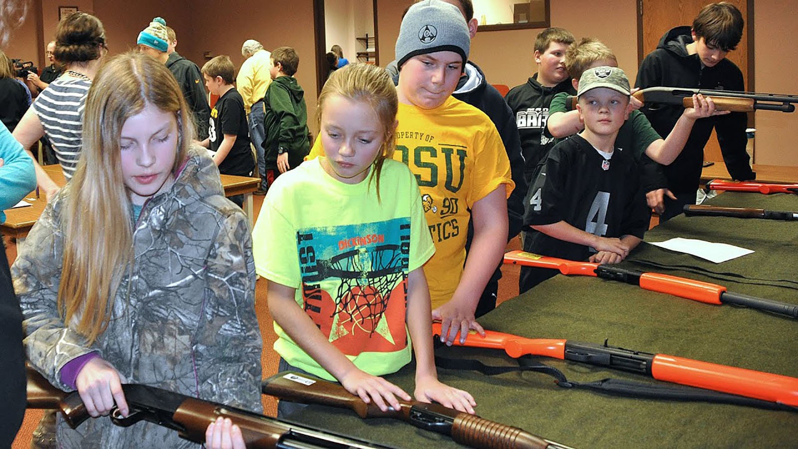 A hunting education class for young students in North Dakota. Wyoming officials said Monday they intend to expand programs here despite Biden administration attempts to kill them at the federal level.