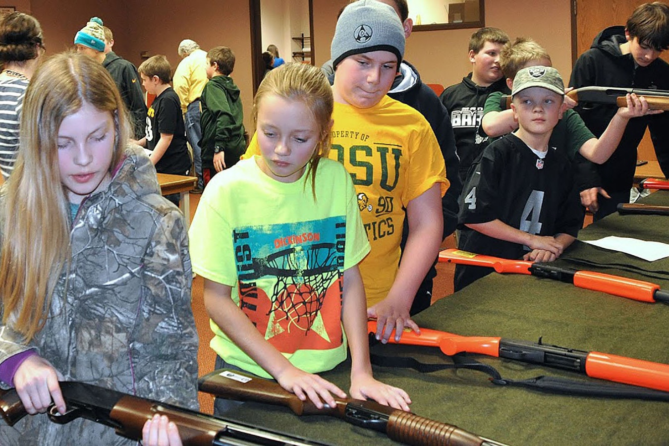 A hunting education class for young students in North Dakota. Wyoming officials said Monday they intend to expand programs here despite Biden administration attempts to kill them at the federal level.