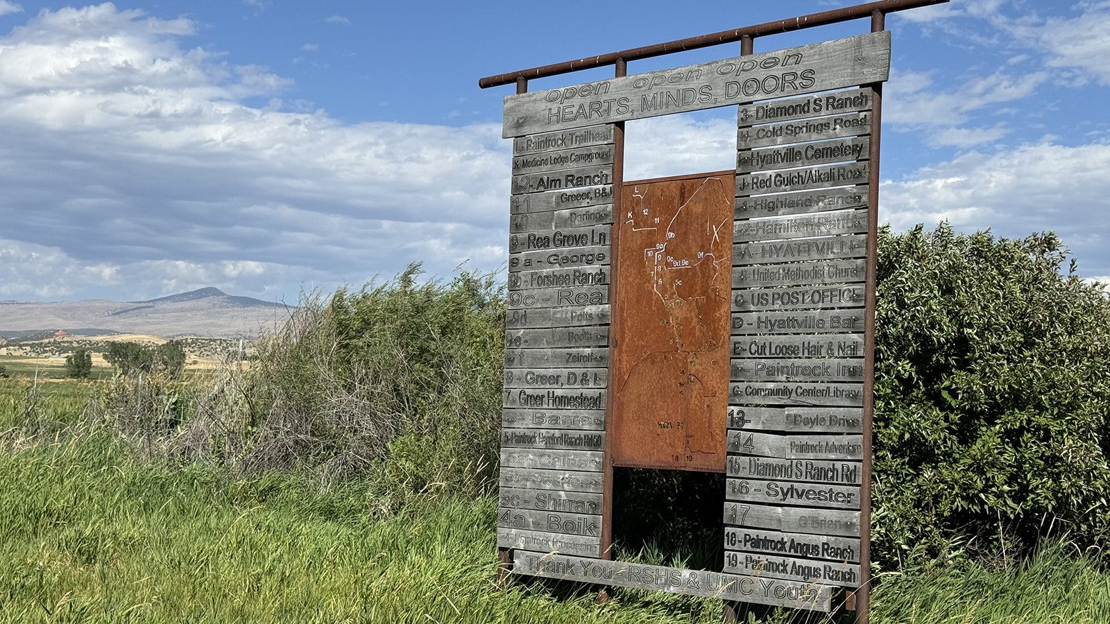 The faded sign features a metal map of Hyattville marking all the important points of interest in the town.