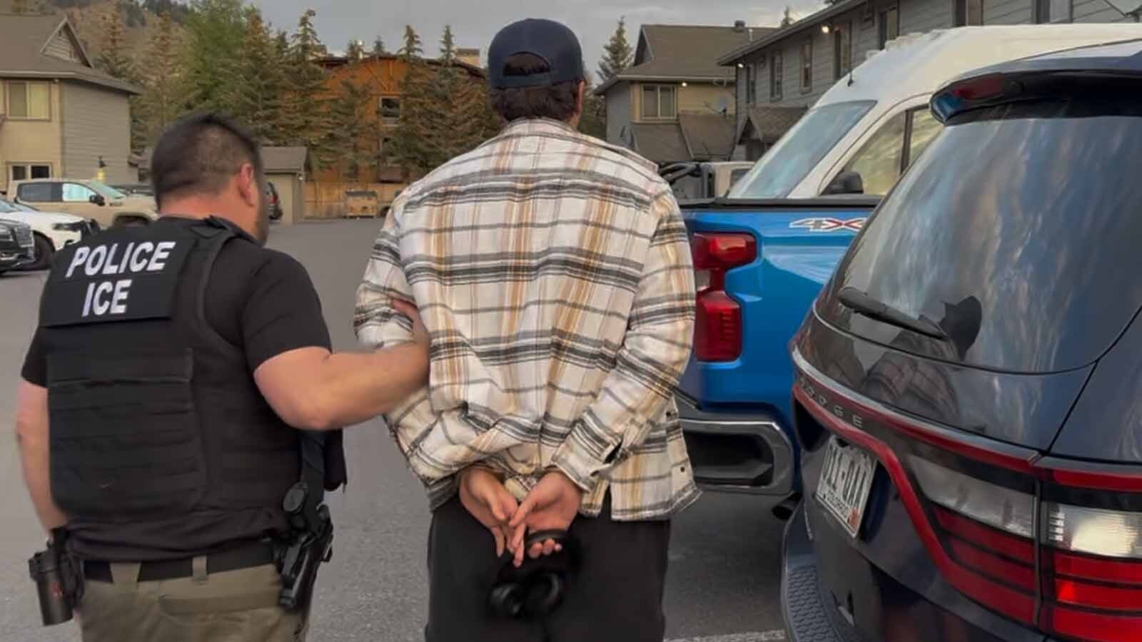 Alberto Banicescu, 27, left his apartment wearing a ball cap, cream-colored flannel shirt and shorts. Officers arrested him, handcuffing his wrists behind his back, and led him to the back seat of an SUV.